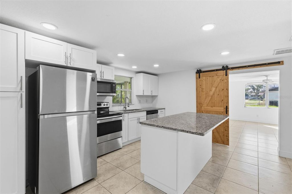 Photo of 5802 Greenwood Way, Holiday, FL 34690 (MLS # TB8471059)