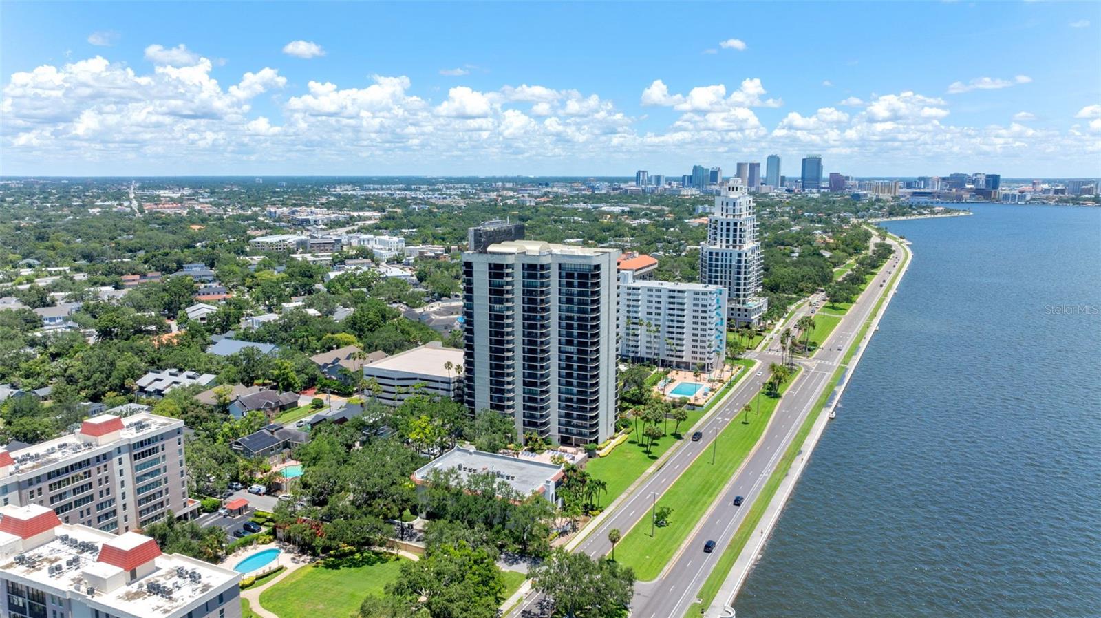 One or more photo(s) has been virtually staged. Live above it all on the 14th floor of The Atrium on Bayshore! This fully turnkey 2BR/2BA condo is a BLANK CANVAS and TURNKEY for its next lucky owner and features a RARE OPEN-CONCEPT KITCHEN—completely reconfigured with sleek shaker cabinetry and seamless flow into the living space. FRESHLY PAINTED walls, ceilings, baseboards, and doors throughout with NO CARPET, updated baths, two private balconies with BAYSHORE AND CITY VIEWS, and custom BUILT-IN WALK-IN closet in the primary suite plus built-ins in the guest room. MILESTONE STUDY IS COMPLETE and all assessments are PAID, giving total peace of mind and a strong HOA. A PRE-INSPECTION report is complete, so you can buy with confidence. Includes in-unit laundry hook-up, garage parking, and Atrium’s resort-style amenities: heated pool/spa, fitness center, BBQ area, clubhouse, and 24/7 security. Minutes to Hyde Park, Midtown, Water Street & TGH.