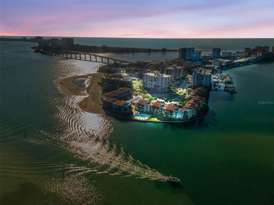 A breathtaking waterfront escape awaits in this 2-bedroom, 2-bath Clearwater Beach condo, perfectly perched on the 8th floor of a resort-style high-rise. Bright and open, the spacious kitchen and living area flow seamlessly into a sun-filled indoor balcony/Florida room; ideal for enjoying your morning coffee with sunrise views or winding down at sunset. Both bedrooms have private balcony access with stunning water vistas, creating serene retreats to unwind. Exceptional amenities include three sparkling climate controlled pools and large jacuzzi, private beach access, outdoor beachside grilling stations, and inviting patio and fireplace areas. Coastal living at its finest—where every day feels like a vacation.