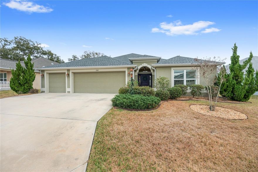 ~GOLF COURSE AND WATER VIEW~ ~ROOM FOR A POOL~ ~GLASS ENCLOSED LANAI~ ~2019 ROOF~ ~2019 HVAC~ ~2019 HOT WATER HEATER~ ~GC GARAGE~ Welcome to your dream home in the highly sought-after Village of MONARCH GROVE in The Villages! This exceptional MOSSY OAK model showcases breathtaking GOLF COURSE and WATER VIEWS, offering a serene and picturesque setting for enjoying the Florida lifestyle. Step inside to soaring VAULTED CEILINGS and an OPEN, AIRY FLOOR PLAN designed for both comfort and entertainment. CERAMIC tile flooring flows through the main living, dining, and kitchen areas, highlighted by a ceiling fan in the living room and updated FANDELIER lighting / fan in the dining space. The chef-inspired kitchen is beautifully appointed with GRANITE countertops, STAINLESS STEEL appliances, an ISLAND with additional cabinetry, SOFT-CLOSE DRAWERS, and convenient bottom roll-out cabinets—perfect for both everyday living and hosting guests. Retreat to the luxurious primary suite featuring CERAMIC tile flooring, an elegant TRAY CEILING, ceiling fan, and an OVERSIZED WALK-IN CLOSET. The spa-like primary bath offers a TILED ROMAN SHOWER, DUAL sinks, GRANITE countertops, high vanities, and a private commode area. Guests will feel at home with 2 well-appointed guest bedrooms. The front guest room includes plush carpet, PLANTATION SHUTTERS, ceiling fan, and a built-in closet, while the adjacent guest bath features a TILED shower/tub combination, CORIAN countertops, and an elevated vanity. The 3rd bedroom serves as a private EN SUITE with its own WALK-IN closet and BATH featuring a TILED walk-in shower and high CORIAN countertops—ideal for visitors. The spacious laundry room includes CERAMIC tile flooring, a utility sink, cabinetry, shelving, and SAMSUNG gas dryer and electric washer. Enjoy year-round relaxation in the GLASS-ENCLOSED LANAI with painted floors, TELESCOPING SLIDERS, 2 ceiling fans, all under HEAT and AIR—perfect for taking in the stunning views in any season. This home features an OVERSIZED 2-CAR GARAGE PLUS GOLF CART GARAGE with attic stairs. GUTTERS surround the home, and there is ample space to ADD A POOL. It is close to the Live Oak Pitch & Putt Golf Course, the St Tropez Rec Center, Well Point Rec Center and Edenfield Rec Center. Shopping, dining and medical are close by at Magnolia Plaza. This remarkable home combines luxury, comfort, and unforgettable views in one of The Villages’ most desirable locations.