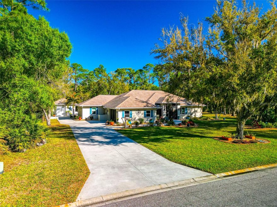 This Mill Creek home sits on a quiet street on a full 1-acre homesite, surrounded by mature trees that create a shaded, private setting that’s getting harder to find.

The owners have gone through the home top to bottom and made the updates that matter. Major improvements include a new roof, hurricane impact windows, a newly built saltwater pool, extended driveway with plenty of parking, detached garage for added flexibility, and an invisible fence already in place. It’s the kind of property where you’re not walking in and building a to-do list.

Inside, the updates continue. New flooring runs throughout the home, paired with a freshly painted interior that gives it a clean, move-in ready feel. The kitchen is the centerpiece and it’s been done right. Dual quartz islands provide both workspace and gathering areas, complemented by premium wood cabinetry, stainless steel appliances, and a cabinet-depth refrigerator and freezer. The pot filler is a practical upgrade, and the dedicated coffee bar adds everyday convenience. Storage is a real strength here, highlighted by an oversized, unique pantry with additional built-ins and even a second refrigerator.

The layout offers space where it counts. Three guest bedrooms and two additional bathrooms give flexibility for family or visitors. A large den with barn-style doors works well as a home office, media room, or flex space depending on your needs.

The primary suite is spacious and well thought out, with three walk-in closets that solve the storage issue most homes have. The bathroom has been fully updated with dual sinks and a walk-in shower, keeping everything consistent with the rest of the home.

Out back is where this property really opens up. The large lanai overlooks the saltwater pool, and the outdoor fireplace creates a natural gathering spot for evenings or weekends. Between the pool, yard space, and privacy, it’s set up for both entertaining and everyday use.

Mill Creek continues to stand out for buyers who want space without giving up convenience. Low HOA fees, no CDD, strong schools nearby, and easy access to everything around Lakewood Ranch, without being right on top of it.

Be sure to explore the virtual tour for a full 3D walkthrough.