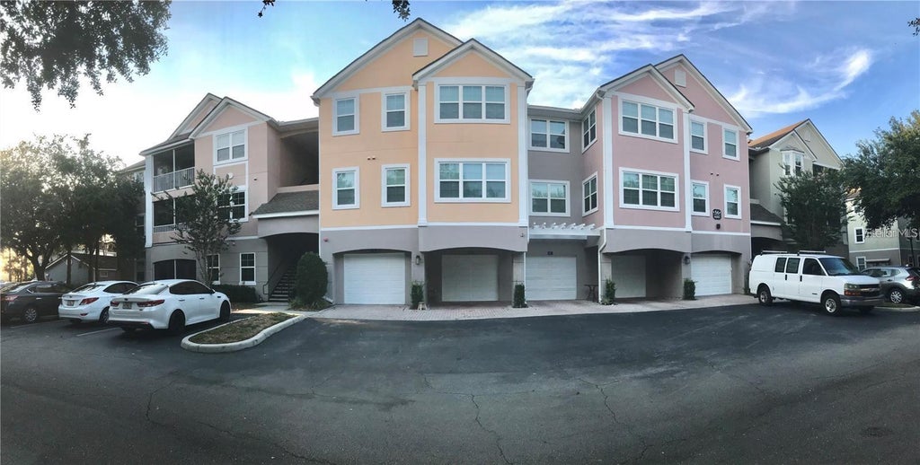Photo of 6627 Queens Borough Avenue #108, Orlando, FL 32835 (MLS # O6419826)