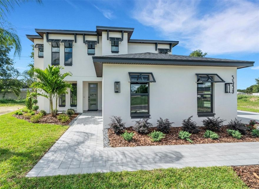 Introducing the Rhi Model by Hulbert Homes—a stunning two-story residence in the coveted gated enclave of Clubhouse Hills Estates in South Lakeland. Offering 5 bedrooms, 4.5 baths, this home perfectly blends modern design with timeless livability.

Step inside to an open floor plan anchored by a spacious Great Room, designed for gathering and entertaining. The gourmet kitchen steals the spotlight with quartz countertops, shaker-style soft-close cabinetry, stainless Frigidaire Gallery appliances, a walk-in pantry, and an oversized island ideal for casual dining or hosting.

The private primary suite, located on the first floor, is a true retreat featuring a spa-worthy bath with double vanities, a large walk-in shower, a garden tub, and an oversized, walk-in closet. French doors provide direct access to the lanai, blending indoor and outdoor living.

Upstairs, you’ll find four additional bedrooms and 3 full baths, including 3 en-suites that are perfect for guests, extended family, or a growing household. A dedicated office on the main floor offers the flexibility to work or study from home.

Outdoor living shines here too—triple sliding doors open to a covered lanai with paver flooring, creating a perfect backdrop for morning coffee or evening gatherings.

Additional highlights include:

Warm wood flooring in main living area, 

Stylish tile in wet spaces,

oversized side entry 3-car garage, 

Paver driveway & professional landscaping.

Just minutes from top-rated schools, shopping, dining, and commuter routes, this home offers the best of South Lakeland living—an elegant new construction in a quiet, exclusive setting.

Don’t miss the chance to make this Hulbert masterpiece your forever home.