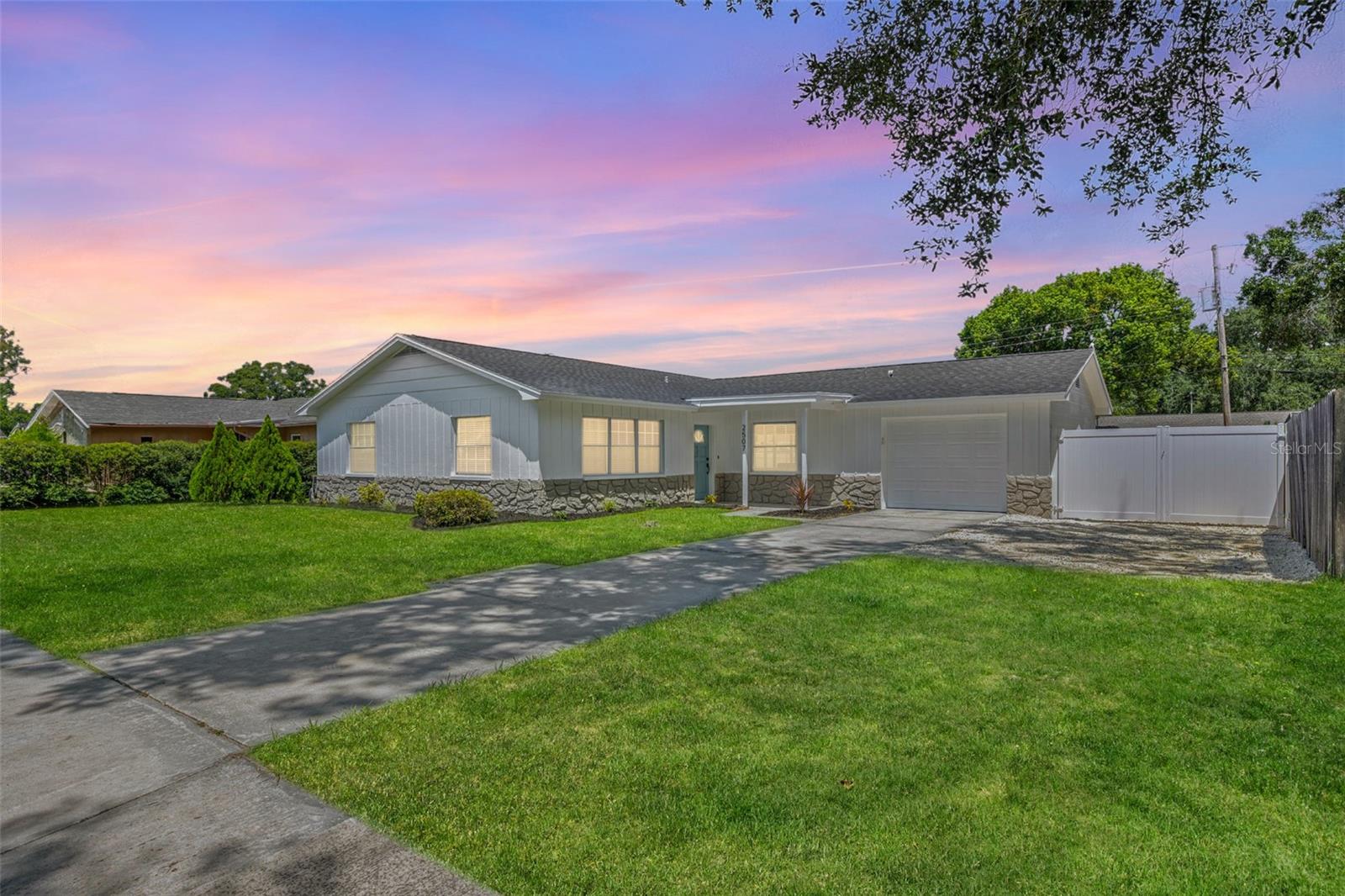 Welcome to your turn-key, move-in ready boho beauty in the sought-after Lake Magdalene community of Carrollwood! This fully renovated 3-bedroom, 2-bathroom home has been upgraded from top to bottom with thoughtful details and modern finishes throughout. Step inside to find luxury vinyl plank flooring, fresh interior paint, and a bright, airy design that creates a warm and stylish atmosphere. The kitchen is a true showpiece, featuring brand-new cabinets, quartz countertops, an oversized island, and all-new appliances—perfect for both everyday living and entertaining. Both bathrooms have been beautifully updated, while additional highlights include a laundry closet with charming barn doors, epoxy-coated garage flooring, and completely updated systems with a BRAND NEW ROOF (2025) AND A/C (2025), as well as updated electrical wiring—giving you worry-free living for years to come. Outdoor living is just as impressive: enjoy mornings on the tiled front porch, unwind screened-in and tiled back patio, or host gatherings in the expansive newly pavered outdoor area. A double vinyl fence allows you to securely park your boat or RV, while the freshly rocked driveway offers extra parking space. A backyard shed provides additional storage, and the landscaped front yard enhances curb appeal. Located in the desirable area of Tampa, this home is close to shopping, dining, parks, and top-rated schools. With its boho-chic charm, turnkey upgrades, and true move-in readiness, 2507 Hollis Drive is the lifestyle upgrade you’ve been waiting for!