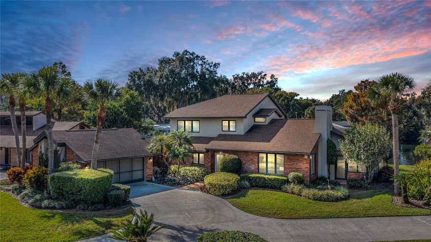 Experience the best in lakefront living. This home features a spacious living room with stunning lake views, a wet bar, and a fireplace. The beautifully remodeled kitchen includes an eat-in breakfast bar, stainless steel appliances, and granite countertops. The oversized dining room offers elegant crown molding, built-in lighted shelving with cabinetry, granite counters, and a chandelier. Enjoy the convenience of an indoor laundry room with built-in cabinets. The expansive two-car garage is enclosed and includes a workshop area. The main floor primary suite features crown molding and a walk-in closet, while the ensuite bathroom boasts a walk-in tiled shower. A generous second primary bedroom is located on the upper level. The loft is equipped with a built-in desk and cabinetry. The oversized family room provides views of both the canal and the lake. Water and sewer bills are included in the HOA dues. Boat slips and storage units are available by waitlist. Nearly every room in the home enjoys picturesque lake and canal views.