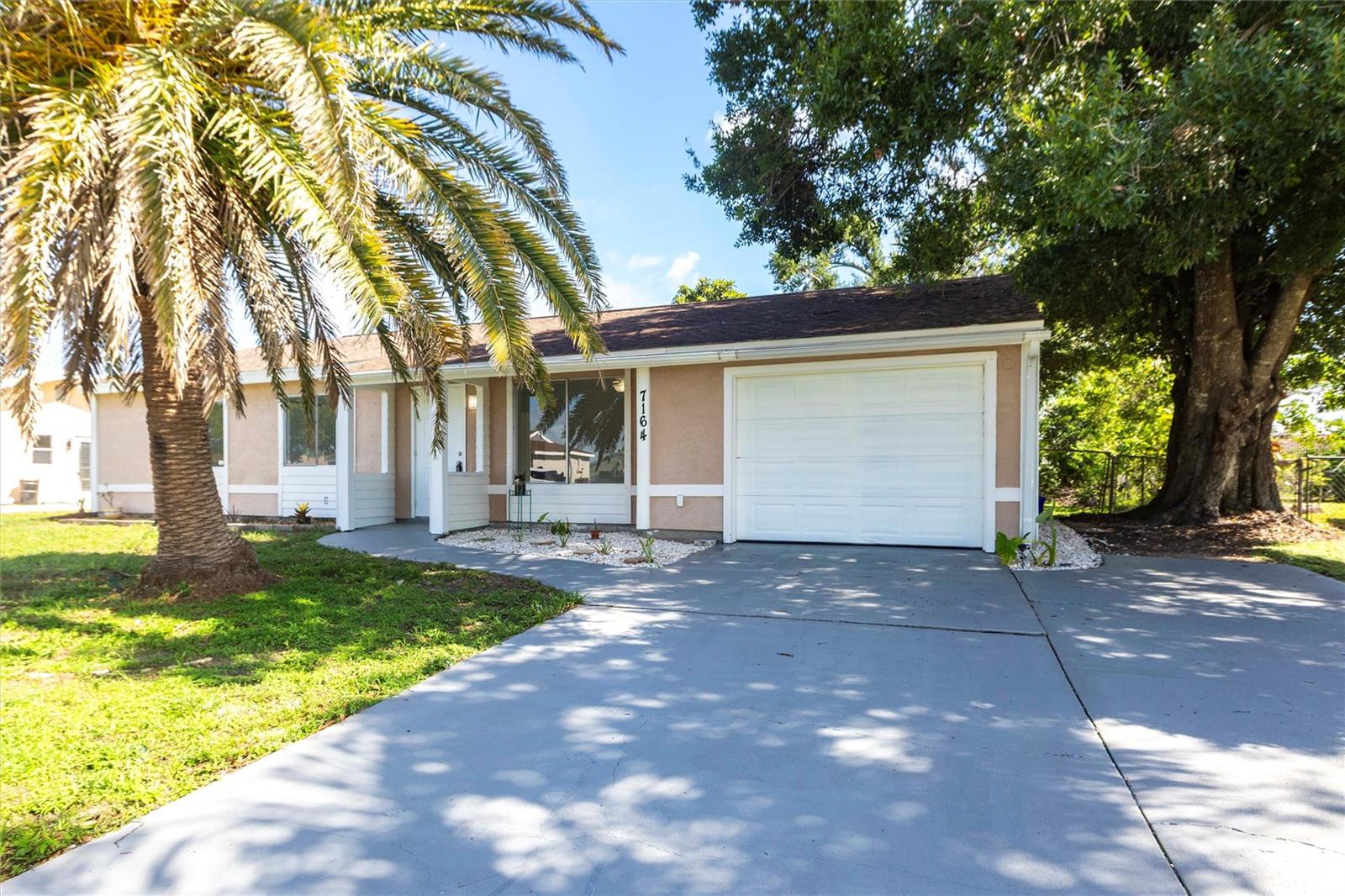 Welcome to your Florida retreat in the heart of North Port! This delightful 3-bedroom, 2-bath single-family home is nestled on a quiet cul-de-sac in the desirable Jockey Club community—a welcoming neighborhood where friendly neighbors, well-kept homes, and top-notch amenities combine to create an outstanding lifestyle at an exceptional value.
Built in 1979 and lovingly maintained, this home boasts a thoughtfully updated interior with tile flooring throughout for easy maintenance and timeless appeal. The open-concept layout flows effortlessly between the living room, dining area, and kitchen, creating a space that feels both airy and connected. The renovated kitchen features modern cabinetry, generous counter space, and a layout that’s perfect for both cooking and entertaining.
A flexible bonus room just off the kitchen offers the perfect space for a home office, creative studio, or playroom, giving you room to adapt the home to your lifestyle. Recent updates include fresh interior paint that adds brightness and a clean, contemporary feel throughout. Generous windows invite natural light into every corner, creating a warm and cheerful atmosphere.
The primary bedroom suite offers comfort and privacy, while two additional bedrooms and a second full bath provide plenty of space for family, guests, or a home gym. All rooms feature durable finishes and a cohesive, neutral palette ready for your personal touch.
Step outside to discover your private backyard oasis—fully fenced for privacy and pets, and landscaped with fruit trees, including a mango and a mature loquat tree. A spacious patio is ideal for outdoor dining, BBQs, or just relaxing with a good book. With a generous 10,400 sq ft lot, there’s ample room to garden, play, or even add a pool. Whether you’re seeking serenity or space to entertain, this backyard delivers.
Notably, this home has never experienced flooding and sits high and dry, providing peace of mind in all seasons.
Living in the Jockey Club means access to resort-style amenities without the high fees. For just $25/month, enjoy a heated community swimming pool, tennis and basketball courts, shuffleboard, cornhole, grilling and picnic stations, and a vibrant clubhouse with community events throughout the year. It’s the kind of place where neighbors become friends and everyday life feels like a vacation.
The location couldn’t be more convenient. Minutes from I-75 and Tamiami Trail, this home offers quick access to everything Southwest Florida has to offer. Spend the day soaking in the Warm Mineral Springs, splashing around at the North Port Aquatic Center, or catching a spring training game at CoolToday Park, the seasonal home of the Atlanta Braves. You're also close to Gulf Coast beaches, championship golf courses, shopping centers, local restaurants, major airports, and even a dog park just a short stroll away.
Whether you're a first-time buyer, a retiree looking for low-maintenance living, or an investor seeking a move-in-ready rental in a high-demand area, 7164 Gama Court offers unbeatable value, space, and lifestyle.
Don’t miss this rare opportunity to own a well-cared-for home with room to grow, relax, and thrive—in a neighborhood that feels like home the moment you arrive.