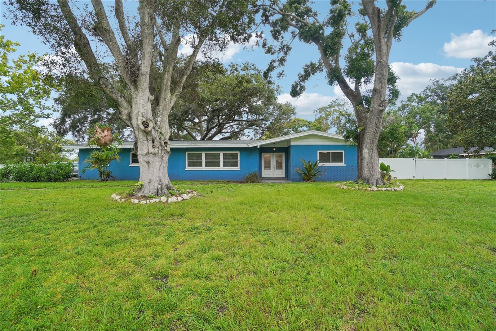 Waterfront Acreage with Direct Canal Access—Incredible Potential & Recent Upgrades!
Welcome to this spacious 3-bedroom, 2-bath, 2-car garage home, offering 2,274 sq ft of living space on over one acre of waterfront property. Nestled on a quiet cul-de-sac with canal access to Old Tampa Bay, this property presents a rare opportunity for buyers seeking privacy, space, and a chance to customize in one of the area’s most desirable locations.
Enjoy peace of mind with major updates completed in 2022, including a new roof, HVAC system, asphalt driveway, double-pane insulated windows with Kevlar hurricane covers, and a stunning, fully remodeled kitchen. The kitchen features a GE Profile induction cooktop, KitchenAid built-in double ovens, a GE Profile dishwasher, a pot filler, an outside-vented hood/fan, a Kraus undermount sink, and a garbage disposal—all beautifully paired with gray wood-look ceramic tile flooring that flows throughout the home, adding a seamless, modern touch.
The home experienced 3 to 4 inches of water intrusion during Hurricane Helene in 2024. Baseboards throughout will need replacement—a perfect opportunity for new owners to finish the home to their taste.
Inside, the spacious living and dining rooms are ideal for entertaining, while the oversized family room with a wood-burning fireplace offers comfort. A large bonus room adds flexibility for a potential 4th bedroom, home office, or additional living space.
Enjoy stunning canal views from the family room, breakfast nook, or while relaxing on the river rock patio—the perfect spot to watch dolphins play. The attached 2-car garage provides ample storage, and the expansive lot offers plenty of room for outdoor living or future enhancements, such as a pool.
All this, just minutes from top-rated beaches, shopping, dining, and local parks. Don’t miss this exceptional chance to own a waterfront property with incredible potential!
