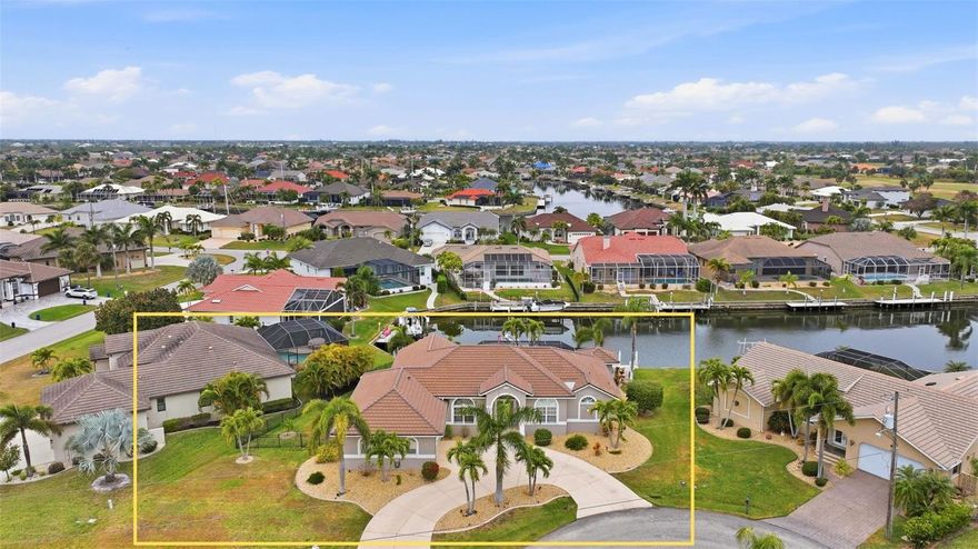 Welcome to 318 Santander Court, an exceptional WATERFRONT residence nestled in the highly sought-after community of Burnt Store Isles in Punta Gorda. Perfectly positioned on a SERENE CANAL with approximately 35-MINUTE ACCESS TO OPEN WATER, this refined 3 BEDROOM + DEN, 2.5 BATH POOL HOME offers the ideal blend of LUXURY LIVING and the ultimate SOUTHWEST FLORIDA BOATING LIFESTYLE.

From the moment you arrive, pride of ownership is evident with a NEW ROOF (2023) and HURRICANE SHUTTERS providing both curb appeal and peace of mind. Inside, an inviting and SPACIOUS FLOOR PLAN flows effortlessly from room to room, designed for both elegant entertaining and comfortable everyday living. Natural light fills the living spaces, drawing your eye to TRANQUIL WATER VIEWS and the SPARKLING POOL beyond.

The OVERSIZED OWNER’S SUITE is a private retreat overlooking the pool, complete with a well-appointed en-suite bath featuring DUAL VANITIES and generous space to unwind. The thoughtfully designed split floor plan provides privacy for guests, with a GUEST BATHROOM ALSO FEATURING DUAL VANITIES. A versatile DEN offers endless possibilities — ideal for a HOME OFFICE, CRAFT ROOM, MEDIA SPACE, or additional guest accommodations.

At the heart of the home, the EXPANSIVE KITCHEN boasts ABUNDANT COUNTER SPACE, AMPLE CABINETRY, and STAINLESS STEEL APPLIANCES — perfectly suited for hosting gatherings or preparing quiet dinners at home. The seamless INDOOR-OUTDOOR FLOW leads to your screened lanai and pool area, where a convenient POOLSIDE HALF BATH enhances functionality for entertaining.

Step outside to your PRIVATE DOCK and 10,000-LB BOAT LIFT (ONLY ONE YEAR OLD), making days on the water effortless. Whether cruising through the canals or heading out to CHARLOTTE HARBOR and beyond, this property is a TRUE BOATER’S DREAM. Recent mechanical updates further enhance value and comfort, including a NEWER A/C (2021), POOL HEATER (2023), and POOL PUMP (2025).

Offering TIMELESS WATERFRONT APPEAL, MODERN UPDATES, and EXCEPTIONAL BOATING ACCESS, this Burnt Store Isles residence delivers the FLORIDA LIFESTYLE you’ve been waiting for.