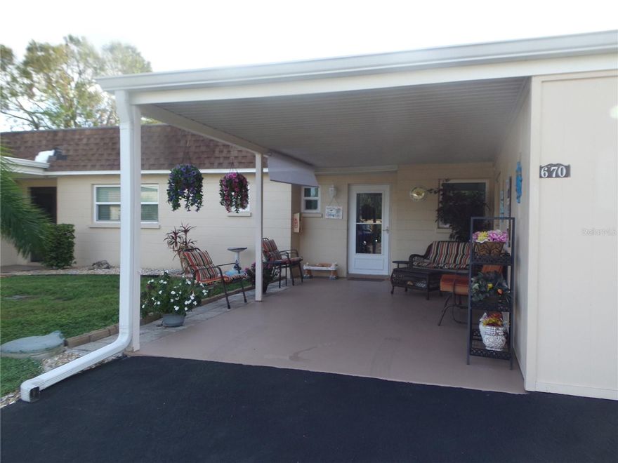 Welcome Home to this Beautifully Updated Villa in Popular Park Acres located on the Inner Circle with a Nice Garden View and Carport Parking at your Door.  This is an Adorable One Bedroom 1.5 Bath unit with a Nice Bonus Room that can be used as a 2nd Bedroom or Office Flex Space. This Lovely Villa is sitting Pretty and Move-In Ready.  The main components of this home have already been updated for your convenience.  The Entire Home Features upgraded Rich Wood Laminate flooring which allows for carefree cleaning.  You will appreciate the Fresh Neutral Paint in the Main Living Areas and some Beautiful color accents in the Bedroom. The Newer Hurricane Rated Windows will make your stay worry free and the 2023 HVAC system will keep you cool in the Summer.  Some other important upgrades include a Newer Hot Water Heater, Newer Stainless-Steel Appliances, New Ceiling Fans and Upgraded Baseboards.  This home also includes a newer Walk-In Bathtub in the Primary Bedroom for the owner's safety. The Kitchen has been updated with some Newer White Cabinets and a Nice Countertop on the left side of the kitchen for additional storage and Counter Space...great for your Coffee/Cocktail Bar!  The Adjacent counters were updated to tile with an easy-care backsplash.  The Lanai was converted to an enclosed Bonus/2nd Bedroom with New Hurricane windows as well and an A/C vent for added comfort.  Utility Room adjacent to Bonus Room house the washer & dryer and Hot water heater. What a Beautiful place to call Home in Manatee County... A one Story Villa in the Heart of Bradenton, close to everything you could wish for and top it off with our World-Famous Beautiful Gulf coast Beaches!  Come on down and Enjoy the Sunshine State in your new Parkway Villa!  Park acres is a very friendly community with a nice Clubhouse and a Gorgeous Pool area for your enjoyment.  This home is priced right and is being offered turn-key furnished for your convenience.  This is one you don't want to miss...it is move in ready and waiting for you.  Call NOW for your Private Showing!!!