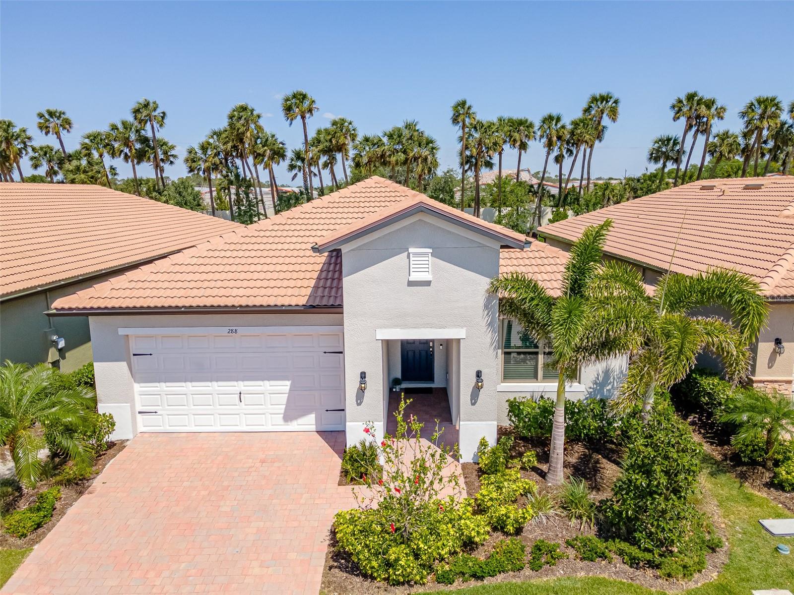 Welcome to this meticulously maintained Charlotte model located in one of the most sought after maintenance free communities of Toscana Isles in the desirable area of Nokomis/North Venice renowned for its active lifestyle amenities and luxurious living. With a prime location that balances convenience and affordable luxury, Toscana Isles is less than 7 miles away to arrive at some of the most beautiful white sandy beaches or be in historic downtown Venice in under 10 minutes. Just 20 minutes North is Sarasota, so this is a great community with easy access to 75. Just minutes away is the new full-service acute care Sarasota Memorial Hospital offering a full slate of medical and surgical care from cardiology to orthopedics. This stunning home is a remarkable 3BR, 2.5BA with a tandem garage perfect for extra storage offering 1,988 sqft of well designed living space. The open concept floor plan perfect for entertaining welcomes you with gorgeous tile plank flooring, elegant crown molding, beautiful woodwork in the front entry and the home is designed with high ceilings throughout making the rooms feel light, airy and spacious. The heart of the home features a chef's kitchen delight with a stunning large white quartz island, a beautiful new stylish tile backsplash, new custom hood & range hood, timeless white cabinetry, stainless steel appliances and a well appointed pantry. The living room is designed for complete convenience right off of the kitchen and dining, sliding glass doors to the peaceful screened in lanai with updated light fixtures and fans, highlighting an upgraded floor outlet great for your everyday electronics. Retreat to the spacious primary suite, complete with an oversized walk-in closet, opposite wall his-and-hers sinks and a large walk-in shower. The huge primary closet conveniently connects to the laundry room for added everyday ease. The home has been enhanced with AC soft start and antimicrobial UV lights with an added upgrade in the primary bathroom for extra peace of mind. Step outside to enjoy the large backyard, perfect for your vision of adding a refreshing year around salt water pool or can be fenced in for privacy. Additional highlights include 2.5 car garage, ideal for a golf cart or motorcycle parking, with ample attic storage space, home hookup for generator connection and each window is equipped with hurricane shutters. The Tuscan inspired curb appeal with a tile roof, brick walkway and driveway and mature landscaping add to the beauty of this well maintained home. Dive into relaxation with a resort-style infinity-edge pool or maintain your fitness routine in the state-of-the-art fitness center. Join friends for a game on the pickle ball courts with this active resort style community surrounded by beauty and nature. The community offers an infinity edge pool overlooking stunning lake views, an amenity center with over 8,000 sq ft with an onsite lifestyle director, state of the art fitness center, lakefront activities room, pickle ball, tennis courts, bocce courts, game rooms, aerobics and yoga studio, catering kitchen, playground, kayak launching dock, a large fire pit and a friendly dog park. Residents are also permitted to go fishing, kayaking, and canoeing on more than 200 acres of ponds within the community. Don't miss the opportunity to live in a home that shows just like a model that provides a fabulous lifestyle with upscale amenities and endless activities. Schedule your visit today!