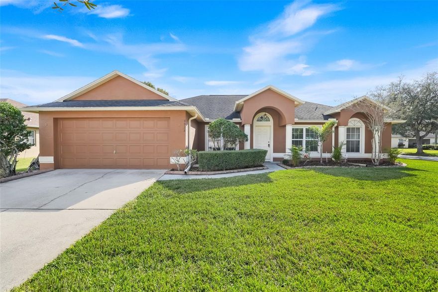 Welcome to EAST LAKE COVE, a sought-after WATERFRONT, GATED COMMUNITY located just minutes from TOP-RATED SCHOOLS and LAKEFRONT PARK with its MARINA and PUBLIC BOAT RAMP. Enjoy convenient access to Narcoossee Rd, US-192, 417, and 528, placing you close to everything CENTRAL FLORIDA offers—from HISTORIC DOWNTOWN ST. CLOUD and the vibrant LAKE NONA TOWN CENTER to ORLANDO INTERNATIONAL AIRPORT, world-famous THEME PARKS, ATTRACTIONS, RESTAURANTS, PAVED TRAILS, GOLF COURSES, TENNIS/PICKLEBALL COURTS, SHOPPING, and more. Nature lovers will love how easily this area connects you to FLORIDA’S NATURAL BEAUTY, with LAKES, WILDLIFE, and SCENIC OUTDOOR SPACES. Situated on an OVERSIZED, GRASSY CORNER LOT with WELL-MAINTAINED LANDSCAPING, this home welcomes you with an inviting FOYER, flanked by a FORMAL LIVING ROOM to the right and a FORMAL DINING ROOM to the left—featuring UPDATED LIGHTING. The comfortable FAMILY ROOM boasts VAULTED CEILINGS, a CEILING FAN, and an open yet well-defined feel thanks to the desirable SPLIT-BEDROOM FLOOR PLAN. Adjacent is a DINETTE AREA that opens to the EXPANSIVE, SCREENED-IN, COVERED PATIO—ideal for enjoying the weather without pests or harsh sun. The KITCHEN is a chef’s delight, showcasing BRAND-NEW QUARTZ COUNTERTOPS, a STAINLESS STEEL REFRIGERATOR AND DISHWASHER, BUILT-IN OVEN, COOKTOP, and a STAINLESS STEEL DOUBLE-BASIN SINK with pull-down faucet. SOLID WOOD CABINETRY and a generous CLOSET PANTRY provide abundant storage, complemented by a LARGE ISLAND BREAKFAST BAR and multiple dining options. A dedicated LAUNDRY ROOM leads directly to the GARAGE with a GARAGE DOOR OPENER. The PRIMARY SUITE features TRAY CEILINGS, an UPDATED CEILING FAN, and a CUSTOM-DESIGNED WALK-IN CLOSET. The PRIMARY BATHROOM offers a LUXURIOUS GARDEN TUB, GLASS-ENCLOSED SHOWER, DUAL SINKS, SOLID WOOD CABINETRY, and NEW QUARTZ COUNTERTOPS. The additional BEDROOMS are WELL-SIZED with BUILT-IN CLOSETS and REFRESHED FIXTURES, sharing a TASTEFULLY UPDATED SECOND BATHROOM with coordinating quartz and wood cabinetry. Major updates include a 2016 ROOF, DOUBLE-PANE, IMPACT-RESISTANT FRONT WINDOWS, a NEW A/C, AIR HANDLER, AND NEST THERMOSTAT INSTALLED IN 2022, and REPLACED SMOKE DETECTORS THROUGHOUT THE HOME, all adding peace of mind. Fresh interior paint in a modern TRENDY GRAY provides a cohesive, stylish look, enhanced by ample NATURAL LIGHT through windows equipped with blinds. Residents of EAST LAKE COVE enjoy DOCK ACCESS TO EAST LAKE TOHOPEKALIGA, the second-largest lake in Osceola County, plus community amenities including TENNIS/BASKETBALL/PICKLEBALL COURTS, PLAYGROUND, PARK, and SIDEWALKS—all covered by LOW QUARTERLY ASSOCIATION DUES. Don’t miss this GOLDEN OPPORTUNITY to make this exceptional home your very own!