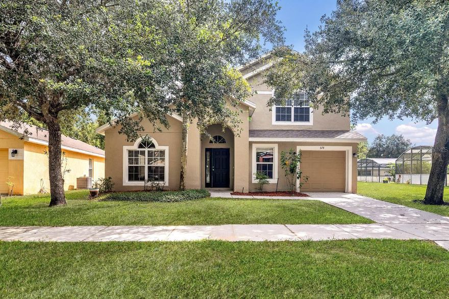 Whether you are looking for multi-generational living, your vacation home, or want to make your investment dream a reality, 678 Sandy Ridge Drive is the home for you! Welcome to this spacious 5-bedroom, 4-bathroom pool home located in the desirable Sandy Ridge community. With no rear neighbors and natural conservation views, this property offers both privacy and comfort. From the moment you arrive, the home makes a strong first impression with its well-maintained landscaping, front porch, and arched entryway. Step inside the foyer, where you’re greeted by a bright living room with vaulted ceilings that sets the tone for the open layout. The kitchen is designed for both everyday living and entertaining, featuring stainless steel appliances, quartz countertops, a closet pantry, and views that overlook the sparkling screened-in pool. This home offers two primary suites—one on the first floor and another upstairs. The first-floor primary features updated laminate flooring, a walk-in closet, and an ensuite bathroom with a large vanity, well-lit oversized mirror, glass-framed shower, garden tub, and provides direct pool access for added convenience. A guest bedroom is also located on the first floor with its own ensuite bathroom, which doubles as a guest bath. Upstairs, the second primary suite includes dual closets (one walk-in) and a private bathroom with a large vanity, well-lit oversized mirror, glass-framed shower, garden tub perfect for soaking the day away! Two additional guest bedrooms share a Jack-and-Jill bathroom, providing plenty of space for family or visitors. Additional features include a 2021 roof replacement, multiple storage closets, and a first-floor laundry area for added convenience. Heading back downstairs in the dining room, through sliding glass doors, you’ll find the large screened lanai with a heated in-ground pool and spa with a waterfall feature—all overlooking the conservation area for a tranquil backdrop and added privacy. The Sandy Ridge community offers sidewalk-lined streets, a playground/park area, tranquil ponds, and much more! This home places you right in the heart of Central Florida’s best conveniences and attractions. With easy access to I-4, US-27, and SR-429, commuting around the Orlando area is a breeze, whether you’re heading to downtown, the airport, or nearby employment hubs. Just minutes away, you’ll find Champions Gate, known for its premier golf courses, shopping centers, and a variety of restaurants. When it comes to world-famous attractions, the location can’t be beat — Walt Disney World is less than 20 minutes away, while Universal Orlando is about a 30-minute drive. Daily necessities are covered, too, with nearby grocery stores, schools, and medical facilities, making Sandy Ridge a convenient place to call home.