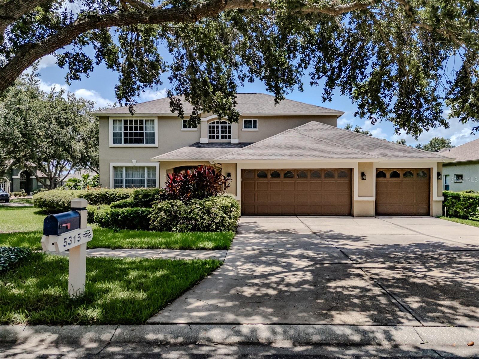This 5-bedroom 3 bath home is located in the highly sought-after 24-hour guard gated River Hills Golf Club Community! The open kitchen offers lots of cabinets & granite countertops and tiled backsplash. The breakfast nook offers a bay window overlooking the sparkling pool. The family room features triple glass sliders that open to the lanai. There is a formal living room and dining room offering loads of space for your holiday dinners. The large primary suite is upstairs and features double doors a sitting area or office area with hardwood flooring. The En-suite features a walk-in shower, dual sinks, a soaking tub and two walk in closets. There are three spacious secondary rooms upstairs. The 5th bedroom is downstairs with access to the full bathroom. The grand entry has double front doors opening into foyer with vaulted ceiling, real hardwood floors, new carpeting, fresh paint, ceiling fans throughout. the storage under the stairs is great for storing holiday decor. The AC was replaced last year. The covered screen enclosed lanai is the perfect place for entertaining with the oversized pool and lanai space. The lanai features a wood ceiling with two ceiling fans. This house sits on an oversized corner lot with no backyard neighbors and offers great curb appeal with the lush landscaping. River Hills community is private and has plenty to offer including nature trails, planned community events like concerts in the park, holiday tree lighting, golf cart parade, resident and guest access to a workout room, dining at the club, and the swimming pool. For additional fees you can also enjoy playing golf on one of the area's most desirable golf courses or play tennis on the clay courts.