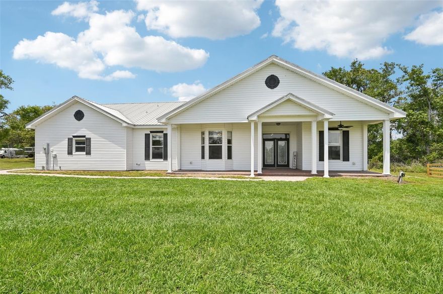 Your country dream begins here — peaceful, private, and full of possibility. Welcome to 5 acres of freedom in beautiful Wimauma, FL — where you can live life your way. Whether you’re dreaming of keeping horses, growing your own food, or simply escaping the hustle of city life, this property offers the perfect blend of comfort, function, and rural charm. This 2,719 sq ft custom concrete block pool home features 3 bedrooms and 3.5 baths with a den and bonus room, thoughtfully designed with both everyday living and entertaining in mind. Bonus room may be converted into a 4th bedroom.  You’ll love the spacious living areas, high-speed Spectrum internet, and the upgraded metal roof for long-term peace of mind. The chef’s kitchen is a showstopper with granite countertops, stainless steel appliances, new gas range and microwave, custom cabinetry with built-in drawers, and a trash pull-out. Pendant lights over the island make it the heart of the home for gatherings, meals, or late-night chats. A flexible utility room provides space for additional refrigerators, a craft station, or home management area. Washer and dryer are included, and the dryer setup also allows for either gas or electric use. The private primary suite offers his-and-hers walk-in closets, dual vanities, and direct access to the screened pool area. One of the secondary bedrooms includes a walk-in closet and private full bath, making it ideal for guests or use as a pool bath. Outside, you’ll fall in love with the resort-style pool and spa, complete with paver decking, a raised planter with cascading water feature and sprays, and plenty of space to sunbathe or unwind beneath the screened enclosure.  As an extra bonus, next to the storage garage, a newly created man-cave equipped with electricity, wifi, a/c, dimmer can lighting & ceiling fan . . . perfect for football season, gaming, office space, & more!  This is a true homesteader’s paradise. The property is fully fenced with two large pastures, perfect for animals, separation, or rotational use. The back pasture is ideal for gardening, farming, or simply space to roam. The front pasture features a barn with an air conditioned tack room with utility sink with hot water & a large closet to secure additional tack accessories, currently set up with two spacious stalls, additional storage, and two large chicken coops, which can easily be converted back to a four-stall barn. There is also ample room to ride and enjoy outdoor space. Despite its peaceful, off-the-grid feel, you’re just a short drive to shopping, dining, banks, and everyday amenities. The seller is including a one-year home warranty covering all major components that includes pool/spa, well, & septic for added confidence and peace of mind. This is more than just a home. It’s a place to create your own slice of freedom, surrounded by nature, animals, and endless possibility. Call today for your private showing and come experience the magic of country living