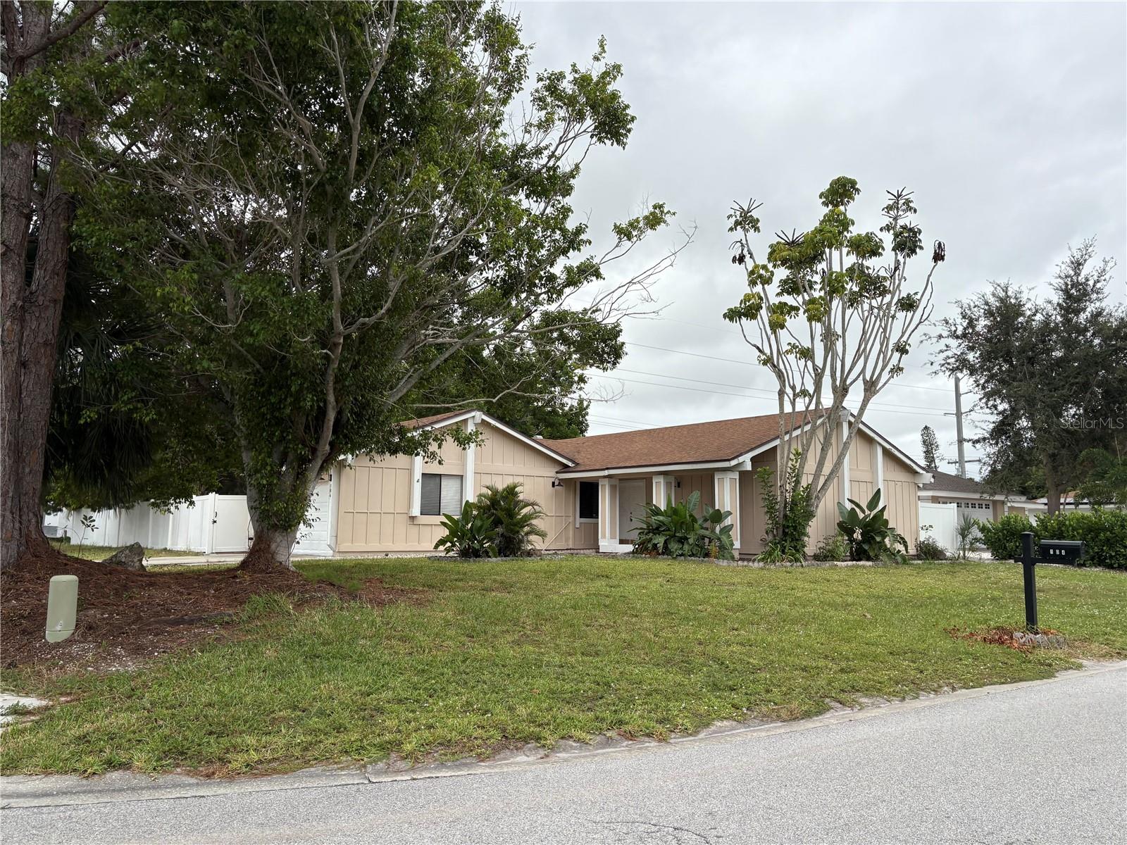 Now available for annual lease, this spacious 3-bedroom, 2-bath home is located in the desirable Harbor Woods community in northwest Bradenton. Offering plenty of room for family and guests, the home features tile flooring throughout, a combined formal living and dining area, a separate family room with a casual dining space, and an updated kitchen equipped with a refrigerator, stove, dishwasher, washer, and dryer. The property includes a two-car garage and sits on a corner lot with a large, fenced backyard—perfect for outdoor enjoyment. Basic lawn care is included in the rent. Just about 6 miles from the stunning beaches of Anna Maria Island, the home is also conveniently close to shopping and dining options. Washer and dryer are not warranted. All tenants are required to participate in the Resident Benefits Package (RBP) for $49.95/month which includes renters insurance, credit building to help boost your credit score with timely rent payments, $1M Identity Protection, HVAC air filter delivery (for applicable properties), move-in concierge service making utility connection and home service setup a breeze during your move-in, our best-in-class resident rewards program, and much more! More details upon application