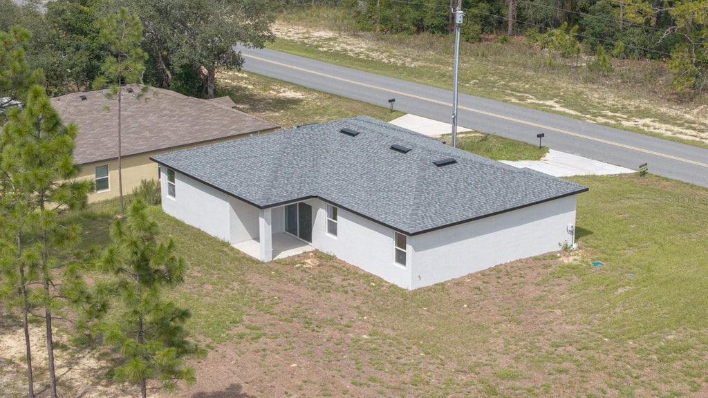 Photo of 11128 N G Martinelli Blvd, Citrus Springs, FL 34433 (MLS # TB8542895)