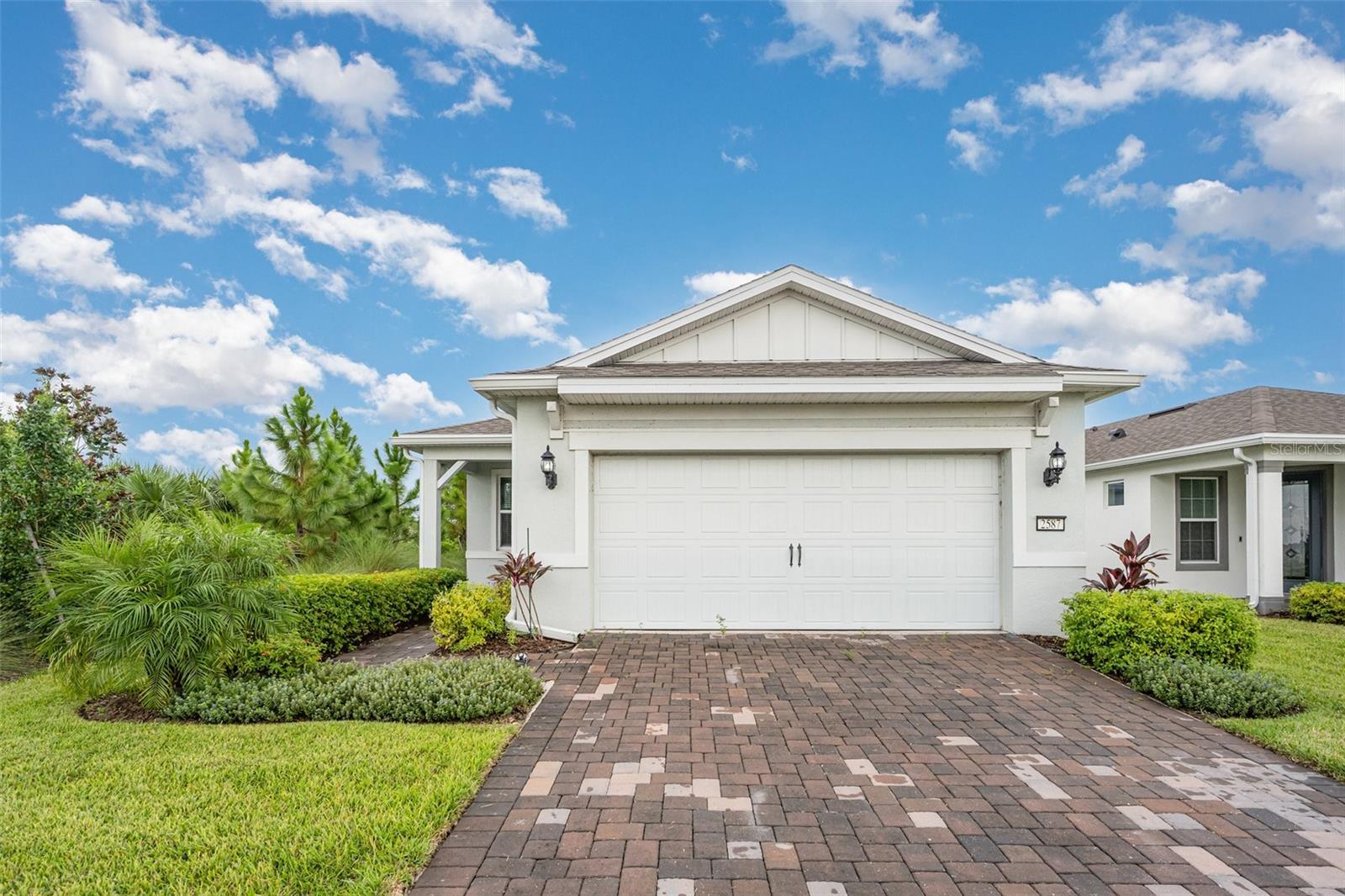 Welcome to 2587 Cliff Way, a beautifully appointed residence in the vibrant 55+ community of Del Webb St. Cloud. Thoughtfully designed with modern elegance and everyday comfort in mind, this home offers the perfect retreat for those seeking an active, fulfilling lifestyle.
Step inside to an open-concept layout that seamlessly connects the living, dining, and kitchen areas—ideal for both entertaining and relaxing. The spacious living room is filled with natural light from expansive windows, creating a warm and inviting ambiance. At the heart of the home, the gourmet kitchen impresses with stainless steel appliances, granite countertops, abundant cabinetry, and a generous island that doubles as a casual gathering spot.
The primary suite is a private haven, featuring a spa-inspired bath with dual vanities, a walk-in shower, and a spacious walk-in closet. A comfortable guest bedroom and additional full bath provide privacy and ease for visitors.
Outside, enjoy your own backyard oasis with a serene pond view. Low-maintenance landscaping ensures more time to embrace the incredible amenities of Del Webb—resort-style pool, clubhouse, fitness center, walking trails, and a full calendar of social activities designed for active adults.
Located in one of Central Florida’s most desirable communities, this home is more than just a residence—it’s a lifestyle. Come experience the perfect blend of luxury, comfort, and community living at 2587 Cliff Way. Schedule your private tour today.