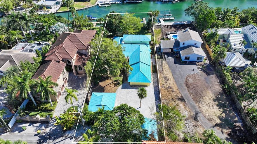 Sailboat Waterfront Property on Siesta Key!! This hidden gem of a sailboat waterfront property on Siesta Key's north end is a boater's paradise, with its expansive 18,367 square-foot lot and over 78 feet of seawall providing unrestricted access to the tranquil waters of Hansen Bayou and Sarasota Bay beyond. Nestled in privacy, it's an ideal location to build your dream home, offering captivating views and the serenity of this unique Siesta Key enclave. Its proximity to Shell Beach public access, as well as Siesta Village and renowned beach Siesta Key Beach along with easy access to shopping, restaurants, excellent schools, the hospital, and the vibrant downtown district of Sarasota, make it a convenient yet secluded retreat for those seeking the quintessential Florida waterfront lifestyle.