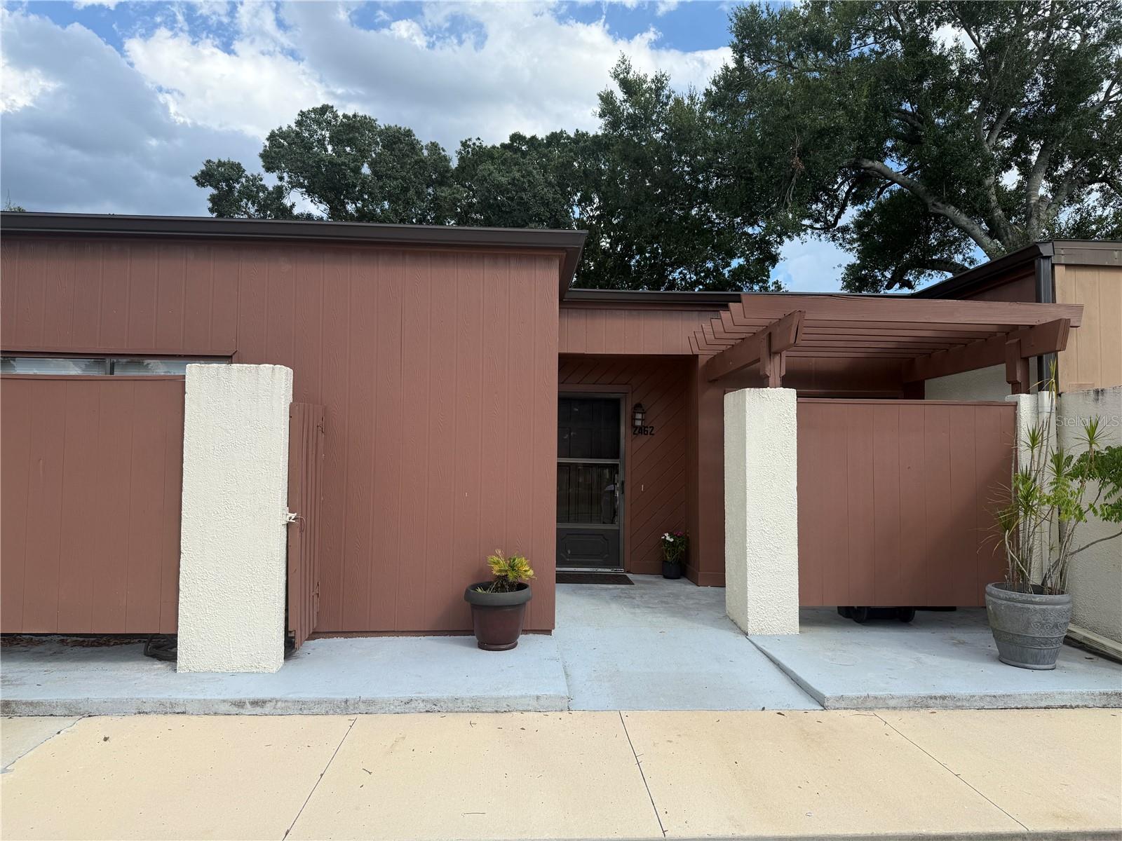 Welcome to 2462 Harbour Way, a beautifully maintained single-story townhome nestled in the highly sought-after Windward Square community of Winter Park. This move-in ready 3-bedroom, 2-bathroom home offers comfort, style, and convenience—all in one of Central Florida’s most desirable areas. Step inside to discover a sunlit dinette that flows seamlessly into a spacious kitchen, featuring gleaming granite countertops and stainless steel appliances—perfect for everyday meals or entertaining guests. The inviting living room is accented by a unique atrium that fills the space with natural light, creating a bright and airy ambiance throughout. The private primary suite includes a walk-in closet and en-suite bathroom, providing a peaceful retreat at the end of the day. Two additional bedrooms offer flexibility for family, guests, or a home office. Enjoy Florida living year-round on your covered back porch and fully fenced patio—ideal for relaxing, grilling, or gathering with friends and family. Tile flooring throughout and NEW ROOF in December 2021. Windward Square offers low HOA fees and fantastic amenities, including a community pool, clubhouse, tennis court, shuffleboard, and playground. Plus, this prime location puts you close to top-rated schools, major universities, shopping centers, dining destinations, and easy access to major highways, Downtown Orlando, and Orlando International Airport—all within a 30-minute drive! Don't miss this opportunity to own a beautiful home in this desirable community in Winter Park. Schedule your private showing today!