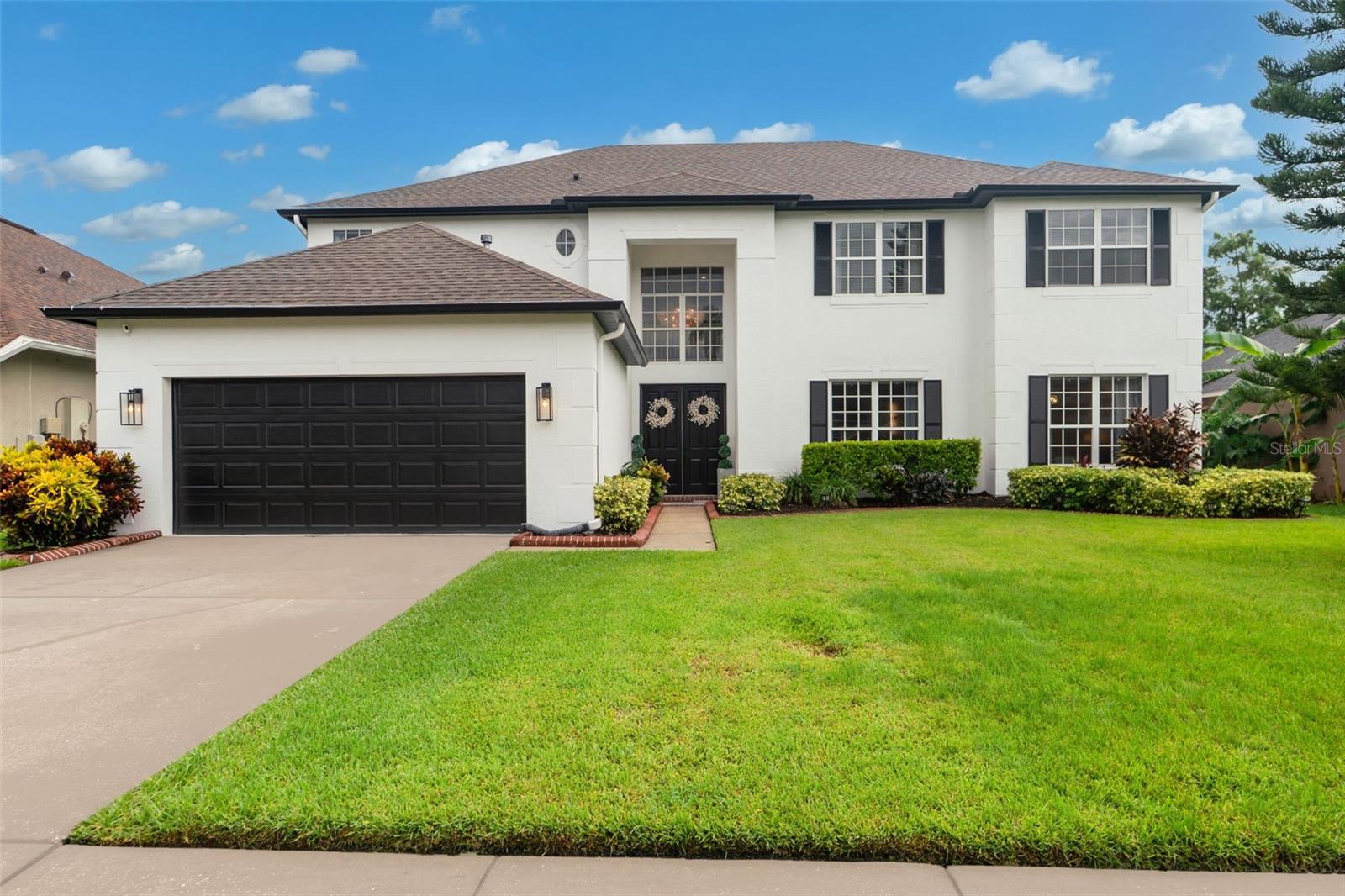 Welcome to your expansive, multigenerational entertainer’s paradise! This stunning 6-bedroom, 4-bathroom home is located in the gated Brookforest enclave of Seven Oaks. Thoughtfully updated throughout, recent upgrades include a new ROOF(2023), three new HVAC units (2023), luxury vinyl plank flooring on the main floor, new carpet upstairs (2023), crown molding, upgraded baths & kitchen, stainless steel appliances, new interior and exterior paint (2023), and privacy landscaping.
Step through the double doors into the foyer and be greeted by a dramatic 25-foot ceiling, a spacious family room filled with natural light from oversized windows and sliding glass doors that open to the beautifully landscaped rear courtyard. On the main floor, you’ll also find a formal living room and formal dining room, perfect for hosting large gatherings. The kitchen features Quartz countertops, a massive island, breakfast nook, a walk-in pantry, and plenty of storage and prep space.
The First-floor Primary suite offers private access to the backyard via sliding doors, along with a luxurious en-suite bath that includes double vanities, a garden tub, separate shower, and a walk-in closet. An additional bedroom and Full Bath on the main floor make an ideal in-law suite or guest suite: currently being used as a main-floor Office.
Upstairs, you’ll find 4 oversized bedrooms, 2 full bathrooms, a loft overlooking the family room, and a massive media/bonus room, perfect for movie nights, gaming, or a home gym. Completely fenced private pool-sized backyard.
The Seven Oaks community offers resort-style amenities including a stunning clubhouse, multiple pools, a water slide, fitness center, playgrounds, and miles of scenic nature trails—all within a secure, gated neighborhood.
Conveniently located near I-75, Tampa Premium Outlets, Wiregrass Mall, top-rated schools, hospitals, restaurants, and entertainment—this is luxury living in one of the most desirable areas of Wesley Chapel.