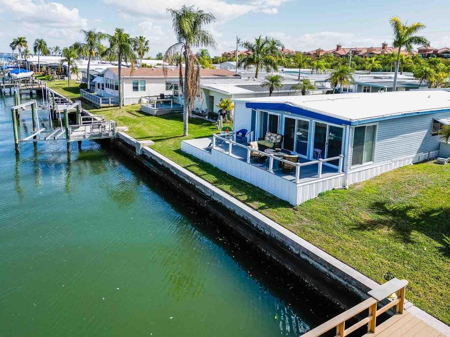 Have you ever dreamt about waking up by the water? This is not simply a property. It is a front row seat to the bay, a cozy retreat filled with light, and a rare opportunity to own a slice of the Florida coastal lifestyle. Set along the beautiful shoreline of Tampa Bay, this two-bedroom, two-bath Bayfront home captures everything buyers imagine when they dream of waking up by the water.
Four expansive sliding glass doors frame a spectacular sunroom that blurs the line between indoors and out, flooding the home with sunshine and uninterrupted water views. The new deck has been thoughtfully designed to maximize the water vistas, creating the perfect setting for morning coffee as the sun rises over the bay or evening gatherings as the sky melts into soft coastal hues. 
Beautiful gray luxury vinyl flooring runs throughout, offering a clean finish that complements this home layout. The spacious laundry room and additional storage provide the practicality so often missing in waterfront properties, making this home as functional as it is beautiful.
Every space feels intentional and inviting, from the open living areas designed for conversation and connection to the quiet bedrooms that offer a peaceful retreat after long beach days. The vibes here are pure coastal charm, comfortable, welcoming, and effortlessly cozy. This is the kind of home where windows stay open to the salt air, where neighbors become friends, and where weekends turn into lifelong memories.
BAV is a vibrant 55+ community filled with amenities and activities. Life in BVA is about more than the view. It is about sunset walks along the bay, and a close knit waterfront community that values both privacy and connection. It is about generations returning year after year, creating traditions by the water and collecting moments that matter. Whether you’re enjoying social gatherings, two scenic fishing piers, a heated swimming pool, a hot tub, shuffleboard courts, or a beautifully appointed clubhouse, there’s always something to enjoy here. With access to nearby bike trails, pristine Clearwater Beach, and the charming towns of Safety Harbor and Dunedin, you’ll find endless opportunities for adventure just minutes from home. Major shopping, dining, and entertainment options are a short drive away, and both Clearwater-St. Pete and Tampa International Airports are just 15–20 minutes away.
At Bay Aristocrat Village, every day feels like a vacation. Experience coastal living at its finest in this beautiful home, where comfort, beauty, and a warm sense of community come together to create your perfect retreat.
(Updates include Water heater 2025, HVAC 2018, Roof over 2025, Flooring 2024, Vapor Barrier, Insulation, HVAC duct work, Washer/Dryer 2025)