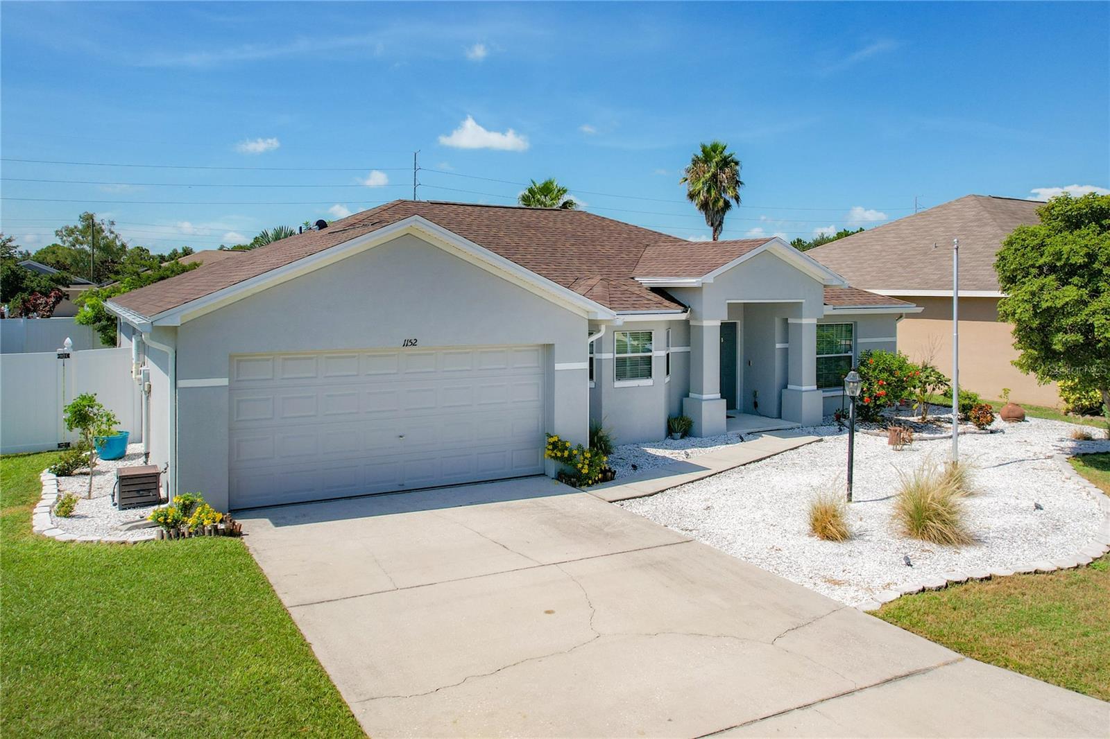 Welcome Home! This 3BR/2BA home located on a corner lot in the gated community of The Shores at Lake Sears has lots of space for everyone to enjoy! Open concept living includes a spacious family room with a high ceiling and sliding glass doors leading out to the screened in patio. Paver area just outside the patio door leads to a huge fenced in back yard perfect for spending time outdoors with family and friends! The eat-in kitchen with a built-in cabinet pantry is great for family meals and get togethers. A separate room off the foyer is perfect to use as a dining room, a den, or a home office. The primary bedroom includes two separate walk-in closets and a private bath with a dual sink vanity, a separate walk-in shower and a soaking tub. A solar energy system is also included with the home and helps keep the electric bills in check! The home is conveniently located with access to the Polk Parkway, schools, shopping, restaurants, and healthcare nearby. Schedule an appointment today to see this beautiful home!