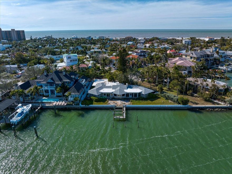 OPEN BAY waterfront LOT in one of North Beaches most desired neighborhoods. Build your own dream home on approximately .31 acres and 164 feet of seawall on this unobstructed bayfront location with direct access to the open waters of the Gulf of Mexico and the widest water views available. Located on North Beach in the exclusive Carlouel enclave with private beach access, 981 Bay Esplanade is a superior bayfront location with deep water dockage and a view that will never change. The two islands, Malone and Moonshine to the east and the pristine wonders of Caladesi Island to the north, are state owned. Wake up to breathtaking sunrises over the bay and walk to the beach for unforgettable sunsets over the Gulf. The value is in the land and is one of only a few available lots along Bay Esplanade and currently the only one in the Carlouel.