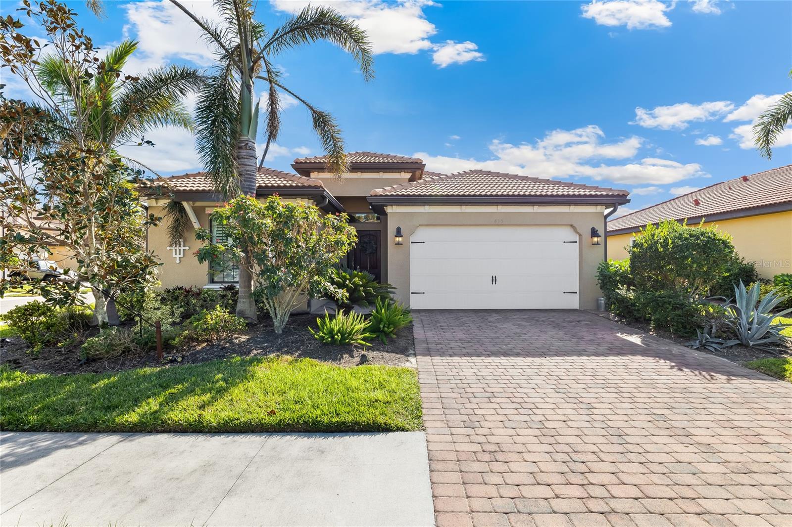 Just a couple miles from the turquoise waters of Nokomis Beach on Casey Key, the boutique neighborhood of Calusa Park beckons you home. This wonderful CORNER LOT home built in 2016 has an open concept floor plan and features granite countertops in the kitchen and both bathrooms, trey ceilings, plantation shutters, Slate 'smudge-proof' GE appliances, custom lighting, ceiling fans in all bedrooms and Great Room, diagonally set tile, and new vinyl plank flooring in bedrooms. Enjoy remarkable SUNSETS past the side VIEW of the LAKE from the screened-in lanai complete with OUTSIDE KITCHEN and EXTENDED paver patio surrounded by lush greenery, palms, oak and pine trees. You can relax by the inviting community pool just down the block or stroll, run, bike the popular Legacy Bike Trail that borders the neighborhood and runs from Venice to Sarasota. The location is perfect. Besides being just minutes from the beach, Nokomis is located between quaint Downtown Venice to the south and Sarasota to the north. It is about 5 minutes from I-75 and the new Sarasota Memorial Hospital as well. With high-rated schools, shops and dining nearby, this beautiful home will check off your boxes and provide the serene Florida experience you desire! This newer home with custom the ceiling fans, window treatments, lighting, and ultraviolet light in the AC unit has NO EXPENSIVE CDD FEES ATTACHED TO YOUR ANNUAL PROPERTY TAXES. Move in and enjoy!