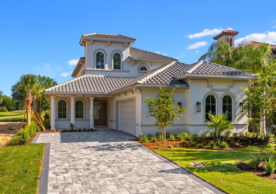 Brand-new custom luxury home in The Conservatory at Hammock Beach!! Perfectly positioned on one of the last remaining golf and water view homesites, this exceptional two-story residence offers 3,041 square feet, 4 bedrooms, and 3 bathrooms, thoughtfully designed with timeless architecture and high-end custom finishes throughout. A grand entryway with a dramatic clerestory open-to-below design creates a striking first impression, immediately drawing in natural light and showcasing the home’s refined craftsmanship. Luxury LVP flooring flows throughout the main living spaces, while expansive sightlines frame stunning views of the Tom Watson–designed golf course and water beyond. The open-concept layout seamlessly connects the living, dining, and kitchen areas—ideal for both relaxed daily living and effortless entertaining. At the heart of the home, the chef’s kitchen is both stunning and inviting, designed for gathering, hosting, and everyday enjoyment. Custom oak cabinetry with soft-close dovetail drawers, decorative hardware, and custom cabinet lighting pairs beautifully with Taj Mahal quartzite countertops and premium GE Café appliances. An elegant custom dry bar with shelving and a bar refrigerator adds a layer of sophistication and convenience.
Wake up to gorgeous golf and water views from your primary suite.  The spa-inspired primary bath elevates the experience with dual vanities, and an oversized walk-in shower featuring a freestanding soaking tub within the shower enclosure. Also located on the lower level are a library/office, a guest bedroom, full bath, and main-floor laundry, offering both convenience and flexibility. Upstairs, an expansive bonus room with sweeping golf course views opens to a beautiful balcony highlighted by a custom decorative railing—providing the same breathtaking scenery and an ideal space to relax or entertain.
Every detail has been carefully considered, including custom built-out closet systems throughout, custom stair lighting, porcelain tile in all bathrooms, dual A/C systems, and a side-entry two-car garage. This home combines luxury with low-maintenance living. HOA fees include lawn care, irrigation, fiber-optic internet, and a manned security gate. Residents may enjoy optional access to resort-style amenities, including a clubhouse, pool, and fitness facilities.
As an added bonus, this brand-new custom home includes a one-year builder warranty. Don’t just imagine it—be the first to live it! Schedule your private showing today!