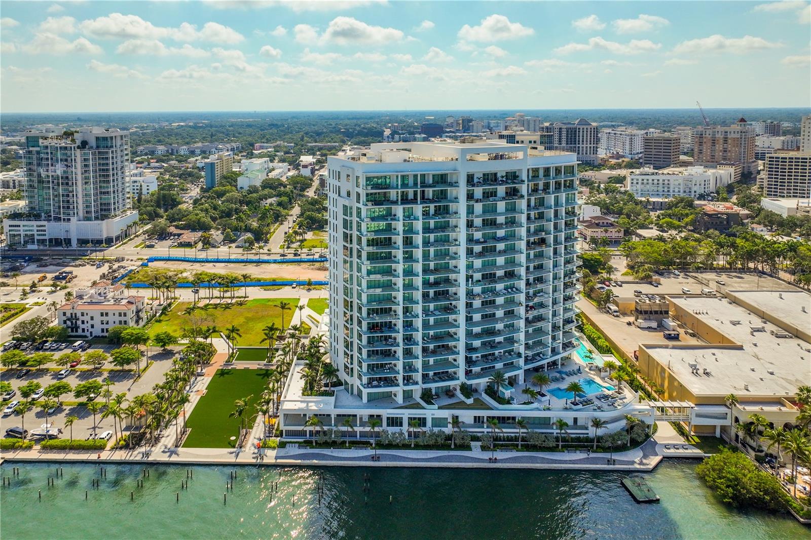 Indulge in the pinnacle of sophisticated waterfront living in the prestigious Sarasota condominium community, The Ritz-Carlton Residences. This luxurious retreat, situated in the most coveted location within the building, offers a host of legendary services and amenities.
Upon entering the private elevator-accessed foyer, thoughtfully placed at the base of the elevators and including two premium parking spaces, you'll immediately appreciate the meticulous attention to detail and enduring elegance. This exceptional residence features three bedrooms, three and a half bathrooms, and over 3,700 square feet of living space. The open-concept floor plan seamlessly connects communal areas with ensuite accommodations.
Additionally, nearly 1,000 square feet of patios provide an ideal blend of family comfort and grand-scale entertainment. Natural light bathes the interior through floor-to-ceiling glass on three sides, framing stunning views of Sarasota Bay, the vibrant cityscape, and the expansive Gulf of Mexico.
Adjacent to the living and dining spaces, the kitchen is a masterpiece, showcasing quartz countertops, sleek cabinetry, top-tier appliances, and a spacious island with captivating waterfall edges. A well-appointed wet bar adds to the allure, making it the perfect setting for cocktail hour.
The master bedroom is a tranquil sanctuary, complete with custom built-ins and easy access to the lanai for your morning coffee ritual. Step out onto the open balcony, where a sleek glass railing ensures unobstructed views of the world-class panorama, including the water, city skyline, and breathtaking sunsets.
The resort-like pool area beckons you to unwind in a haven of relaxation, featuring ample space for sunbathing, a poolside grill, and an outdoor dining area for lavish alfresco meals. The Ritz-Carlton Residences, Sarasota, offers a comprehensive array of resort-style amenities, including a fitness center, lap pool, a separate lounging pool with a hot tub, a club room for social events, a game room, poolside grilling facilities, and access to the hotel and spa. Additionally, 24/7 valet service ensures your every need is met.