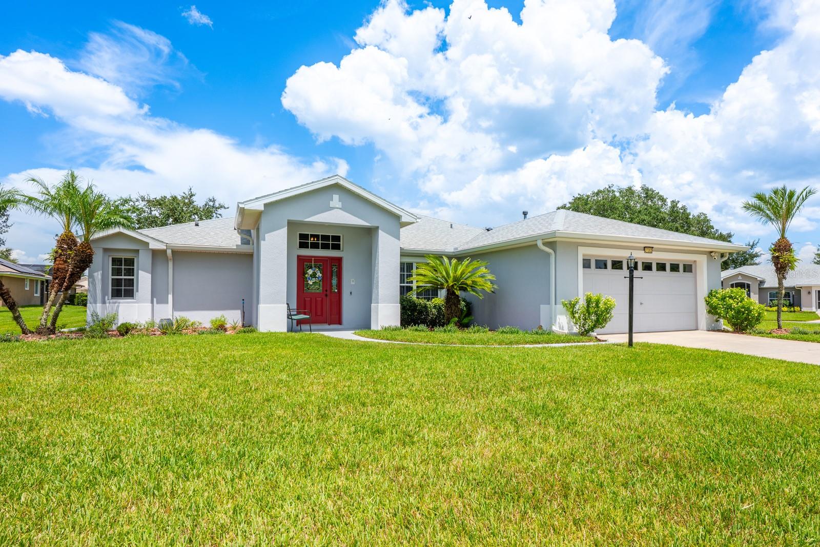 This property qualifies for a credit up to $5475 through the seller's preferred lender / Seller may consider buyer concessions if made in an offer ****Welcome to Legacy of Leesburg, one of Central Florida’s premier 55+ communities, where gated RESORT STYLE LIVING meets thoughtful design in this beautifully maintained single story home! Set on a sprawling .33 ACRE ~ CORNER LOT, this home stands out with a long list of UPDATES and an open, flowing layout that makes everyday living feel effortless. There is a BRAND NEW A/C (2025), NEW STAINLESS STEEL APPLIANCES (2025), a NEW WASHER/DRYER (2025), NEWER ROOF (2019), and fresh paint for a crisp clean canvas. LUXURY VINYL PLANK and TILE FLOORS run throughout – no carpet here – with the new flooring added in the guest bedrooms (2025) and in the primary suite (2023). The remodeled primary bath (2023) adds a touch of modern elegance with a stylish dual sink vanity and tiled walk-in shower. This thoughtfully designed home features a SPLIT BEDROOM LAYOUT, offering privacy for both residents and guests. The light and bright OPEN CONCEPT is enhanced by high ceilings, plenty of natural light, and built-in architectural details that lend a modern but timeless feel. The kitchen is a standout feature at the heart of the home, finished with white cabinetry topped with crown molding, recessed lighting, a breakfast bar, pantry storage and a sunny breakfast nook. The PRIMARY SUITE offers the owner a private retreat, complete with a WALK-IN CLOSET, private en-suite bath, and direct access to the Florida room. On the other side of the home, two generous guest rooms share a second full bath, making the layout ideal for hosting family and friends. What truly sets this home apart is the seamless indoor/outdoor flow. A wall of sliding glass doors opens wide to a spacious enclosed FLORIDA ROOM, perfect for year-round enjoyment. Step further out to a large SCREENED PATIO, an ideal spot for morning coffee or weekend entertaining. Legacy of Leesburg offers residents resort style amenities that support an active lifestyle. With NO CDD and an HOA that includes: gated access, cable, internet, lawn care, and access to the pool and spa, fitness center, tennis and pickleball courts, bocce, horseshoe, softball field, library, computer room, billiards, card room, and even RV storage, there is truly something for everyone! Enjoy the beauty of Legacy Riverfront Park, stroll the scenic walking trails, or meet neighbors at one of the many community events. Conveniently located near US 27, Hwy 48, and Florida’s Turnpike, you are just minutes from local shopping, dining, and the Harris Chain of Lakes – but with amenities like these you might not want to leave home at all! Call today to schedule your tour and fall in love with your new HOME SWEET HOME!