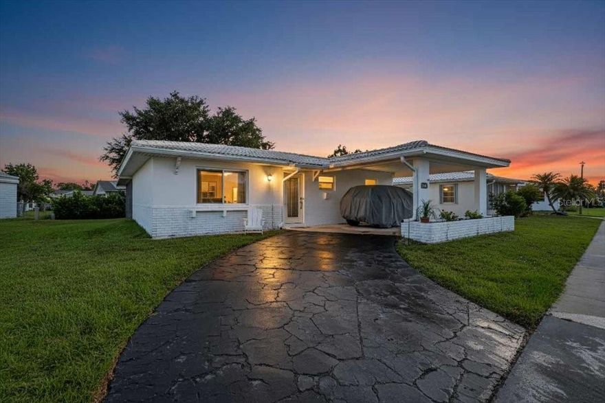 This single-family residence has been extensively renovated and is situated within a small, age-restricted community for individuals aged 55 and older. The homeowners association (HOA) fee of $80 a month includes select exterior maintenance services such as lawn care, roof cleaning and painting, and upkeep of the private road.

The residence features an open floor plan with new flooring, shiplap walls, updated lighting fixtures, and ceiling fans throughout. The eat-in kitchen is equipped with stainless steel appliances, new cabinetry, solid surface countertops, and a tile backsplash that extends to the ceiling.

The home contains two updated bathrooms and an oversized, stackable stainless steel washer and dryer located within the unit. Several windows have been replaced with impact-resistant models, and the front door has also been upgraded with an insulated door.

Bedroom closets are fitted with barn-style doors, and all windows are furnished with drapes. The furnishings in the home including the bedding are also new. The property may be offered fully furnished and ready for immediate occupancy.

Recent renovations include a new kitchen, solid surface countertops, windows and new flooring throughout the residence. The wall separating the kitchen and living room has been removed to create an open layout. Additional improvements comprise of new windows, updated plumbing and electrical, and in 2022 the air conditioning (HVAC) system, new interior doors, wood trim, and an insulated front door with nice glass front and password access.

Conveniently located near shopping and restaurants. It is approximately 5 min to Warm Mineral Springs, 20 min to Englewood Beach, and under a half hour to Downtown Venice, Venice Beach, Sharky's, the Venice Fishing Pier and Dog Beach.