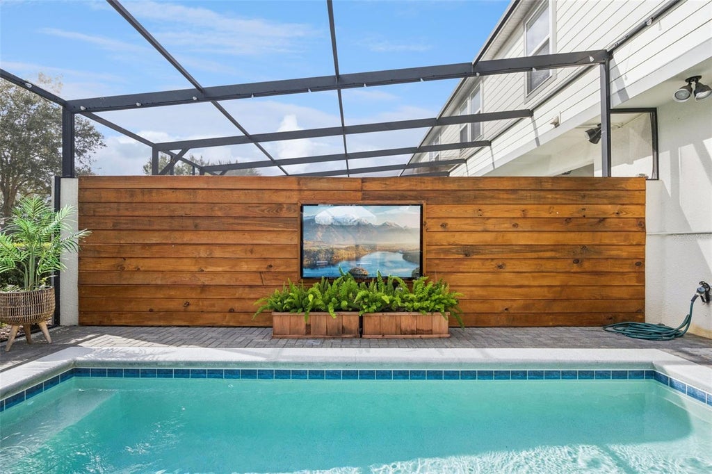 Photo of 7455 Oakmoss Loop, Davenport, FL 33837 (MLS # O6448281)