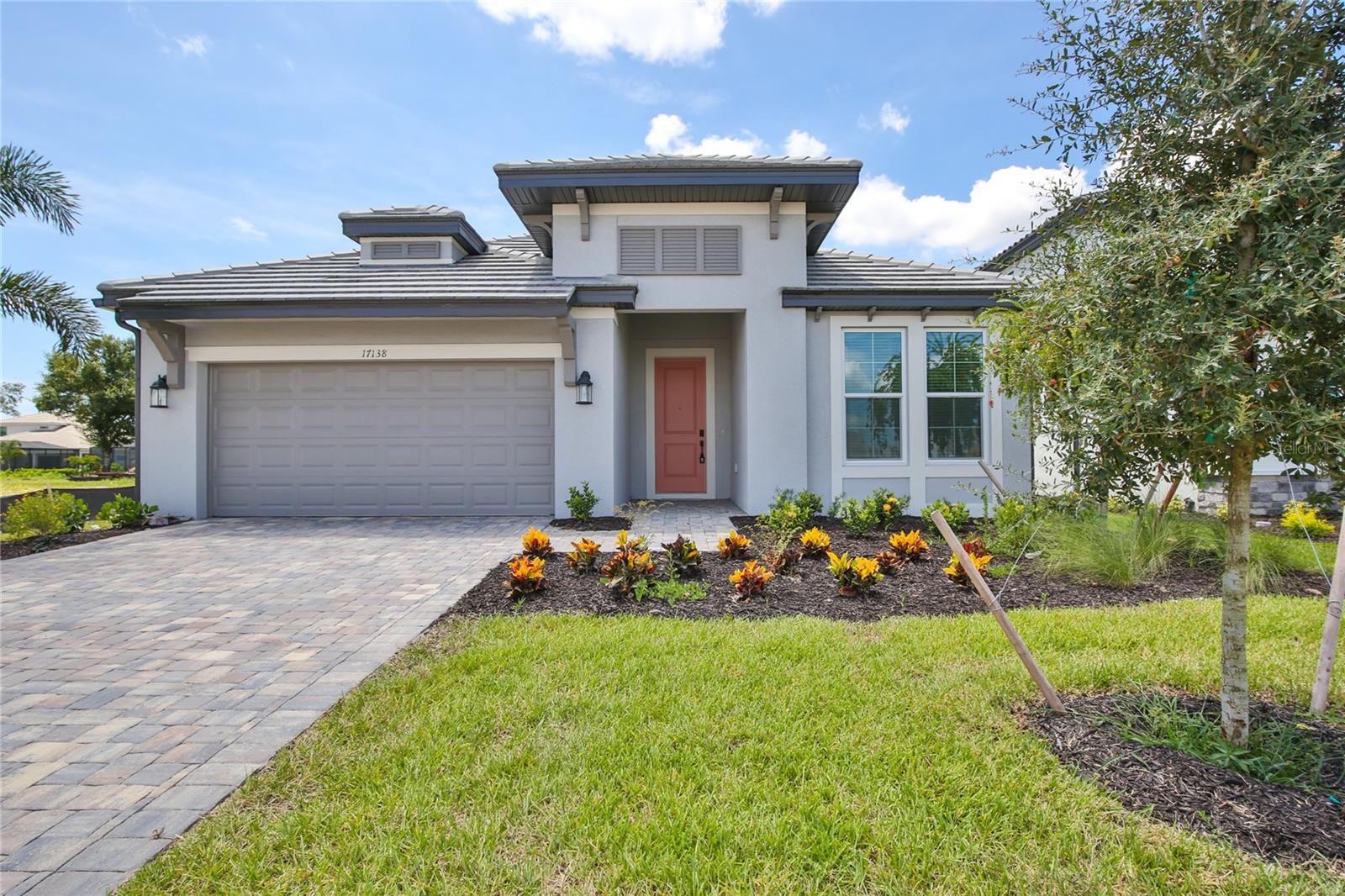 Stunning 4-Bed, 3-Bathroom single story Single Family Home with Patio and attached 2-Car Garage. Welcome to your dream home! This newly constructed single-story residence, completed in 2025, offers the perfect blend of modern design and comfortable living. Located in a serene neighborhood, this 4-bedroom, 3-bathroom gem is the epitome of contemporary elegance and convenience. Interior Features: Spacious Open Floor Plan: Step into an expansive living area that seamlessly integrates the living room, dining room, and kitchen. The open-plan design ensures ample space for entertaining guests or enjoying quality family time. The tray ceilings add to the spacious feel. The living area floor is luxury vinyl. Gourmet Kitchen: The heart of the home features high-end stainless steel appliances, quartz countertops and custom cabinetry. Perfect for the home chef and for hosting gatherings. Master Suite: The luxurious master bedroom offers a private retreat with a large walk-in closet and an en-suite bathroom featuring dual vanities, a soaking tub, and a separate glass-enclosed shower. Additional Bedrooms: Three additional generously-sized bedrooms provide plenty of space for family, guests, or a home office. All bedrooms were upgraded to luxury vinyl. Modern Bathrooms: Both bathrooms are outfitted with contemporary fixtures, stylish tiling, and ample storage. Exterior Features: Private patio with garden view. This tranquil outdoor space is ideal for relaxing, dining al fresco, or watching the sunset. The patio will be screened soon. Attached 2-Car Garage: The spacious garage provides ample room for vehicles and additional storage, ensuring convenience and security. Additional Highlights: New Construction: Built in 2025, this home offers the latest in construction quality and energy efficiency, providing peace of mind and low maintenance. Prime Location: Situated in a peaceful and desirable community, you'll enjoy easy access to local amenities, parks, and schools. Modern Finishes: Throughout the home, you'll find contemporary finishes and thoughtful touches that enhance both aesthetics and functionality. Ceiling fans were installed for added comfort. Don’t miss the opportunity to lease this exceptional property that combines modern luxury with serene lakefront living. Schedule a viewing today and envision yourself in this beautiful home! Sweetwater Community has a pool, fitness center and club house for residents and their guests.