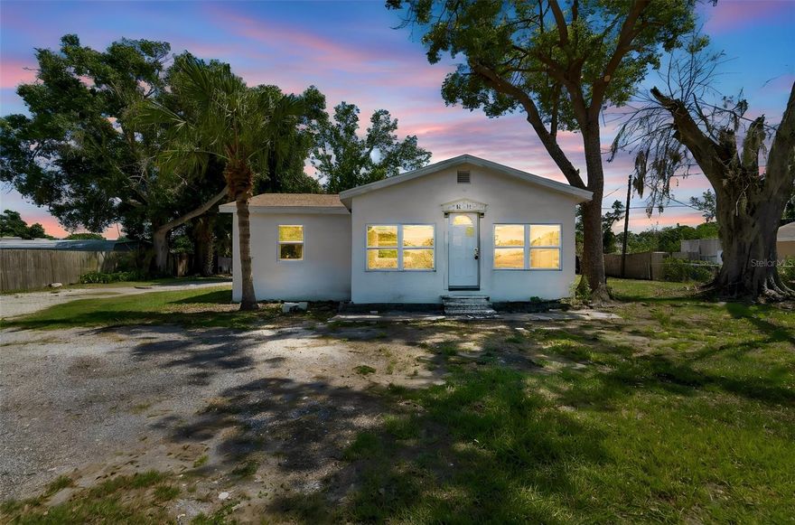 Welcome to 1611 E Shell Point Rd, a 3-bedroom, 2-bath block home tucked under mature oaks on an oversized Ruskin lot. The interior features luxury vinyl plank flooring, white shaker cabinetry, a stainless range, and tiled tub surrounds in both baths. A bright front Florida room wraps the home in natural light from sunup to sundown — perfect as a home office, playroom, or sitting area. Step outside to a private fenced yard with room for boats, trailers, or a workshop, plus a covered side patio and bonus storage shed. No HOA. No CDD. Minutes to US-41, I-75, Apollo Beach dining, Little Harbor Marina, and Gulf access. Excellent opportunity for owner-occupants, downsizers, or investors looking to add a property with land and flexibility in a high-growth Hillsborough corridor. Schedule your private showing today.