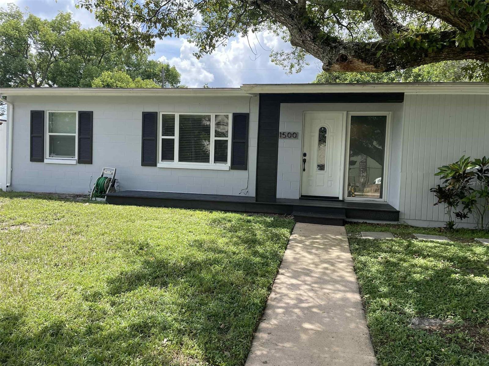 Welcome to this charming 3-bedroom, 1-bathroom home located in a quiet, established neighborhood of Deltona. This home features a bright and open living area, a functional kitchen with plenty of cabinet space, and three comfortable bedrooms.
The large backyard is perfect for outdoor gatherings with a fire pit or simply enjoying Florida’s sunshine. Additional highlights include a carport, laundry hookups, and a convenient location near shopping, dining, and easy access to I-4.