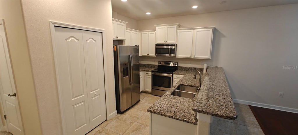 Photo of 8933 Azalea Sands Lane #902, Davenport, FL 33896 (MLS # O6447209)