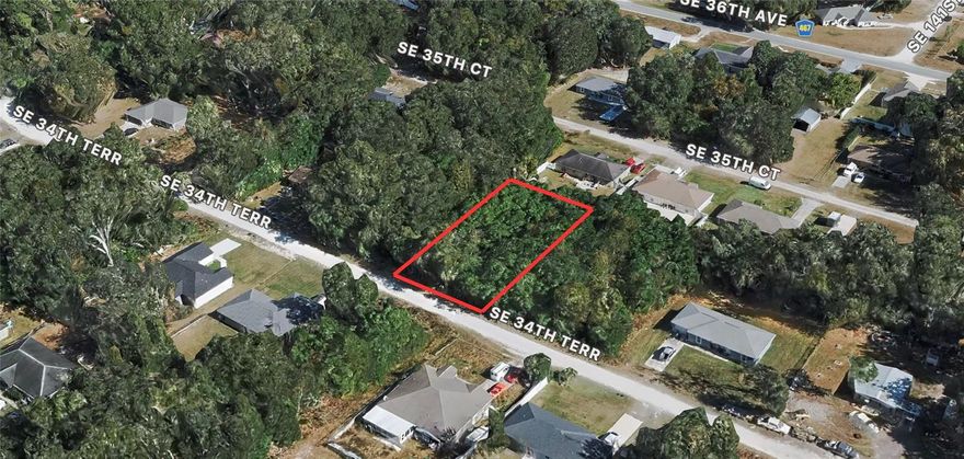 This 0.21-acre lot is located in Belleview Heights Estates, a growing residential area with many newer homes nearby. The property is zoned R1, which allows for a standard single-family home, and sits on a quiet unpaved road with about 75 feet of frontage (75 x 125). It’s fully wooded, giving you privacy and a blank canvas to clear and build the way you want. The lot is in Flood Zone X, meaning no special flood insurance is required. With low yearly taxes and no HOA, this parcel offers an affordable option for someone looking to build a primary home, a rental, or a long-term investment. Buyers should confirm utility connections and building requirements with Marion County.