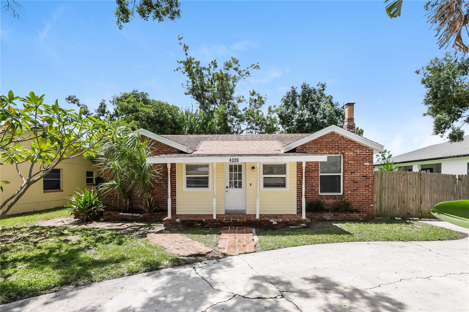 This charming 3 bedroom, 2 bathroom home in the heart of St. Petersburg is bursting with potential and ready for it's next owner! Enjoy the additional parking on the horseshoe driveway as soon as you pull up and be enchanted by the brick walkways and classic details. Inside, enjoy new flooring throughout most of the home and several updates that have been done through the years. Deep backyard with plenty of privacy! Purchase this as your primary home and customize to your liking as you go or pick up your next investment project!! Flood zone X/Non-Evac zone! No HOA! Don't miss your chance!
