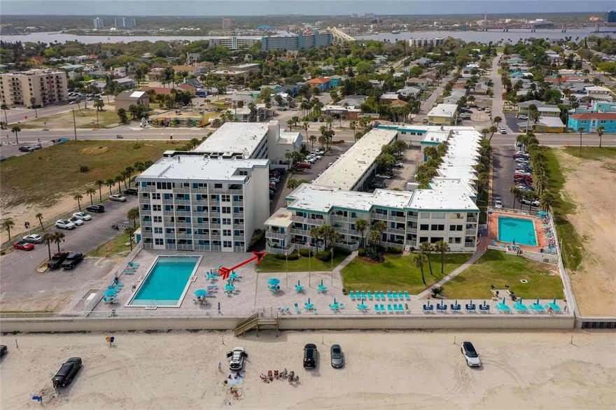 Experience the ultimate coastal lifestyle in this completely updated, direct oceanfront ground-floor studio condominium at Ocean Jewels Club. Short term rental allowable or can be used as your primary residence and homesteaded. Perfectly positioned directly on the oceanfront, this fully furnished unit features an oversized private patio overlooking the pool deck and Atlantic coastline, offering seamless indoor-outdoor coastal living just steps from the sand. The interior features a thoughtful layout with a functional kitchenette, granite countertops, and modern wood cabinetry, while the large mirrored wall enhances the natural light and spacious feel of the living area. The bathroom showcases custom tile work and a glass-enclosed walk-in shower with unique stained-glass accents. Set within a true beachfront community, this unit is positioned to enjoy the best of Daytona Beach with two pools, sun deck areas, beach access, fitness center, laundry facilities, and barbecue area. This complex offers a prime location close to the Daytona Lagoon Water Park, Main Street Pier & Boardwalk, Ocean Center, shopping, restaurants, entertainment and so much more. Whether you're looking for a personal coastal getaway or an income-producing property, this furnished condo offers a beautifully updated interior, resort-style amenities, and an exceptional oceanfront setting. All information recorded in the MLS is intended to be accurate but cannot be guaranteed.