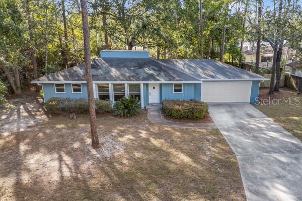 This home sparkles with newness! Kitchen and bathrooms have been fully renovated including granite counter tops, light fixtures and ceiling fans. The kitchen has a large gas oven/range, newer fridge and brand new dishwasher with a view across the family room and out onto a spacious back yard. There is a unique floor plan with an open-air atrium in the middle of the house with access from the living room, family room and kitchen. It brings the outdoors in! There is a large double car garage space for laundry, storage and workbenches. Vinyl double pained windows were installed in March 2018. The electric has been updated and the whole house was re-plumbed. A new garage door was installed summer of 2025. Both the Interior and Exterior have been painted. SOME PHOTOS ARE STAGED.