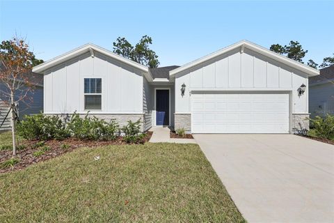 Photo of 49 Wandering Creek Way, Palm Coast, FL 32164 (MLS # FC316570)