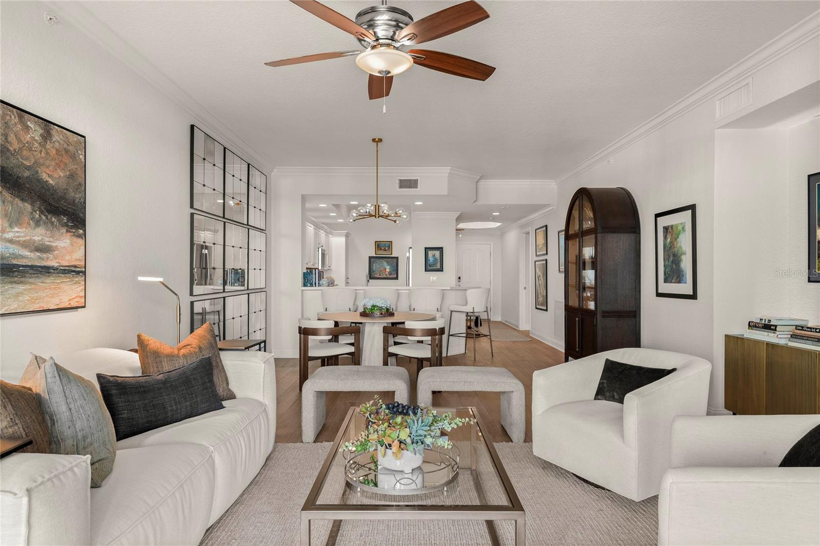 Welcome to coastal sophistication in the highly desirable Minorca community of New Smyrna Beach. This beautifully appointed 2-bedroom, 2-bath residence with a private office blends comfort, style, and functionality, offering sweeping views of the Intracoastal and beyond. Thoughtfully designed interiors feature an open-concept layout with abundant natural light, complemented by tasteful finishes and effortless flow from the kitchen to the living and dining spaces. A spacious balcony extends the living area outdoors, providing the perfect vantage point for evening breezes and breathtaking sunsets. Practical luxuries include in-unit laundry, ample storage, and an additional storage cage for beach gear, as well as assigned covered parking. For peace of mind, hurricane-rated windows and sliding doors ensure security and resilience. The lifestyle at Minorca is truly unmatched, with 24-hour guard-gated security, on-site management, and resort-caliber amenities. Residents enjoy a stunning pool and spa, state-of-the-art fitness center, clubhouse, tennis courts, BBQ grills, and a private beach pavilion. A 64-slip marina adds to the allure, offering boating, dolphin-watching, and sunset cruises, with slips available for purchase. Offering a rare balance of elegance, convenience, and world-class amenities, this residence embodies the ultimate in coastal luxury living—an opportunity not to be missed.