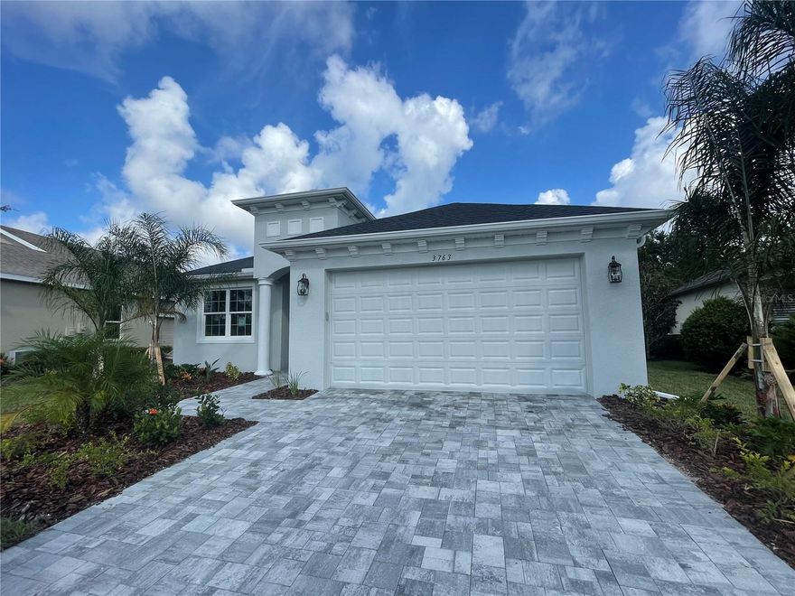 Welcome into the St Thomas; Medallion’s #1 selling great room, open floor plan in Cross Creek. This move in ready, new construction, sparkling pool home with a paver driveway is on a generous pie shaped lot with trees in the back for privacy. This wider, pie shaped lot gives you more elbow room from the neighboring homes. The St Thomas floor plan won best feature in the Parade of Homes for the Master Suite boasting an enormous master bedroom and huge walk in closet, with a gorgeous view of the pool. I challenge you to have enough clothes, shoes, & accessories to fill this huge walk in closet! In addition to the award winning primary suite, this new home features 2 guest bedrooms plus a bright, spacious den off the front of the home. You are sure to enjoy entertaining your guests in your well-appointed modern, white kitchen featuring a gourmet 36” electric cooktop, modern stainless steel hood, built in wall oven / convection microwave, Cambria Quartz countertops and large island that overlooks the dining area and great room with vaulted ceilings. The finishes in this home are absolutely gorgeous! 12 x 24 tile throughout your new home (no carpet), ventilated wood shelving in closets and the pantry, gourmet kitchen package, French door refrigerator, upgraded white quartz with grey veining in kitchen and baths, upgraded, white soft close cabinetry in kitchen & baths, all Moen modern faucets, 10” shower heads, laundry room is trimmed out with cabinets and a beautiful sink base cabinet with deep laundry tub. No hurricane shutters to put up in this house! Medallion Home builds with high quality PGT impact windows and sliding glass doors which will lower your electric bills, cut your homeowners insurance costs, give you peace of mind during storms, and decrease any outside noise. Invite your family & friends over to go into your large, screened in pool with covered, roofed lanai all roughed in for your future outdoor kitchen. Cross Creek is located just 2 miles of the Ft Hamer Bridge and features basketball courts, splash pad, community pool and dog park.