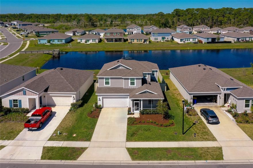 WELCOME HOME to this nearly new two-story residence, built in 2023, perfectly positioned on a picturesque pond with a tranquil fountain view. Enjoy Florida living at its best with a fully fenced backyard and patio—ideal for relaxing, entertaining, or letting pets play freely—plus a charming screened front porch for morning coffee or evening breezes. This spacious home offers 4 bedrooms, 3 full bathrooms, and a 2-car garage, providing plenty of room for family, guests, or a home office setup. You will find clever use of the landing at the top of the stairs, as well. The thoughtfully designed layout blends comfort and functionality for everyday living. Located just minutes from shopping, banking, dining, and daily conveniences, you’ll also love the easy access to both the river and the beach, as well as nearby New Smyrna Beach and Daytona Beach. The community enhances your lifestyle with amenities including pickleball courts, basketball court, playground, and a dog run—something for everyone to enjoy. Plus, the home is situated within a highly regarded public school district. Move-in ready and offering modern construction in a prime location—this one checks all the boxes!