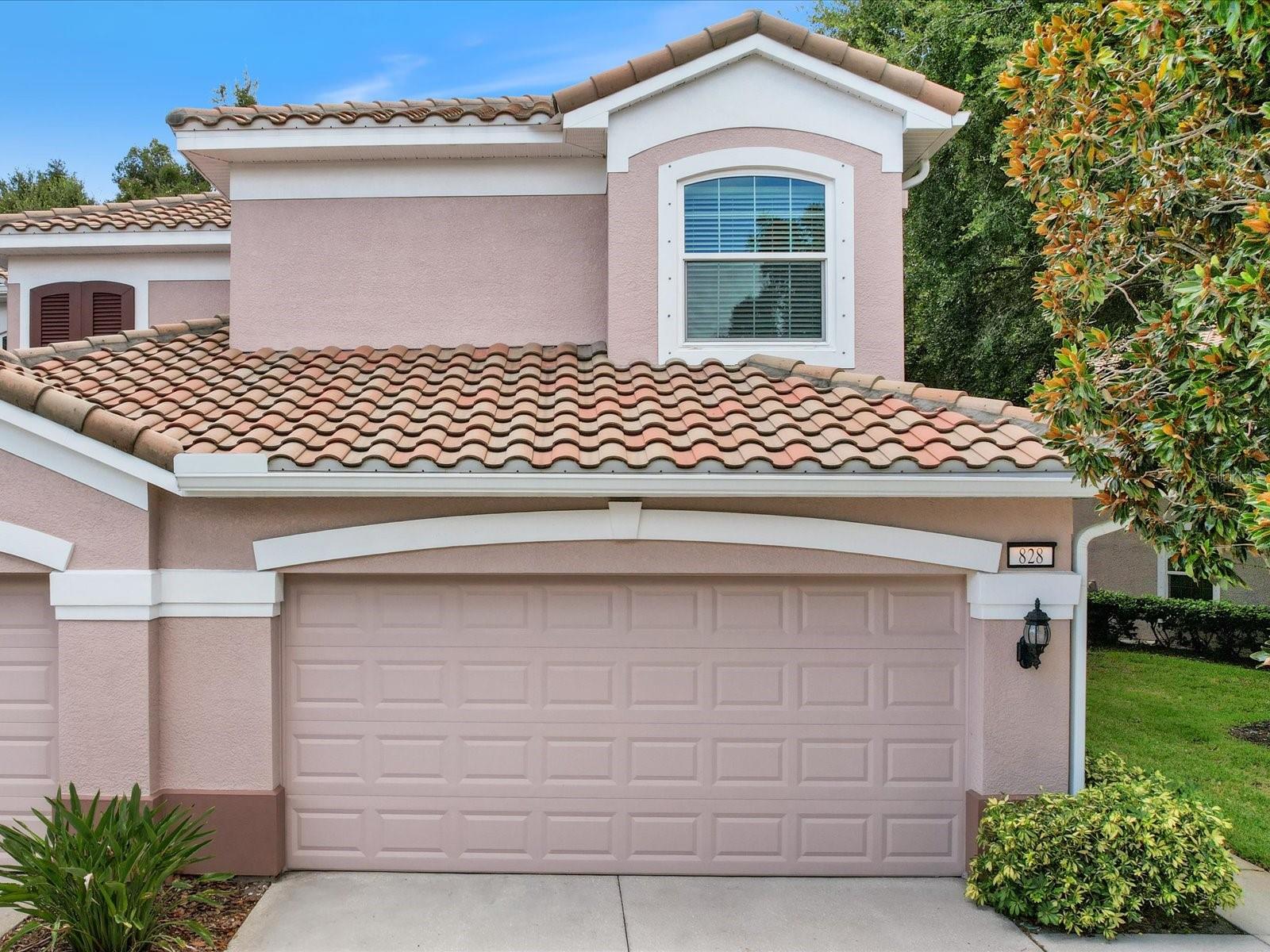 Serenity achieved amongst the hustle and bustle of Clearwater’s growing population. Nestled in its very own preserve the community Coachman Reserve sits. Two entrances offer security gates for easy access to near by entertainment, schools and churches. This unit is over 2000 sq ft with two large bedrooms and a separate den/office. As you enter the front door the foyer gives access to the two-car garage as well as the stairs to the main living areas. At the top of the stairs, you come to the living/dining combo with lots of room for entertaining and a pocket slider leading outside. The kitchen boasts wood cabinets with Corian counters and stainless-steel appliances. Just off the kitchen is an expansive breakfast nook with a view of the wooded preserve and access to the oversized screened in lanai. The primary suite is of ample size with slider to the lanai and provides not one but two walk in California closets and an en suite bath with dual sink vanity, large step in shower and garden tub. The secondary bedroom is larger as well and has a reading nook bench. The secondary bath is shared as a guest bath offering two separate vanities. The den/office can be used for a multitude of things as it also has a closet and window behind its French doors. High ceilings throughout make the place feel so much bigger. The windows were replaced with impact glass in 2018. The A/C was replaced in 2019. They added an accordion style storm shutter to the rear lanai in 2020. The community has a gorgeous open air swimming pool to rival any resort and the fees are manageable. Check out this secluded community today!
