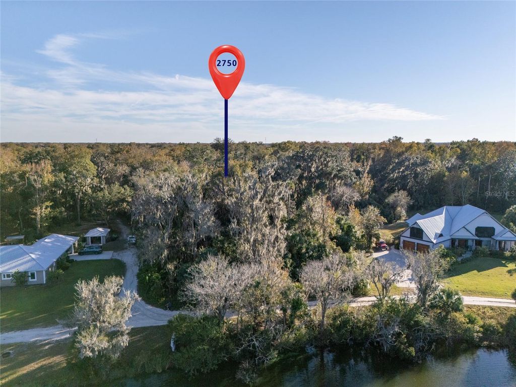 Photo of 2750 Pearl Lake Trail, New Smyrna Beach, FL 32168 (MLS # FC315207)