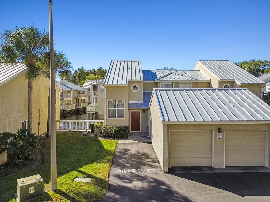 One or more photo(s) has been virtually staged. Welcome to Lake Ellen Walk in the heart of Carrollwood. This updated three bedroom, two and one half bath townhome offers easy, low maintenance living with tile floors throughout, a modern kitchen with granite counters, stainless appliances, and a gas stove, plus convenient in-unit laundry. The first floor primary suite opens directly onto a deck overlooking the pond and fountain, creating a calm place to start or end your day. Upstairs, two spacious bedrooms with vaulted ceilings share a full bath with double vanities.

You will have the convenience of a one car garage and an additional assigned parking space. The community also offers a pool, jacuzzi, fitness room, and a scenic boardwalk leading to Lake Ellen, giving you places to relax, recharge, and enjoy the outdoors close to home.

Living here places you near Carrollwood Village Park, Carrollwood Cultural Center, Carrollwood Country Club, and a variety of nearby cafes and dining options, bringing together comfort, recreation, and the ease of one of Tampa’s most established neighborhoods.