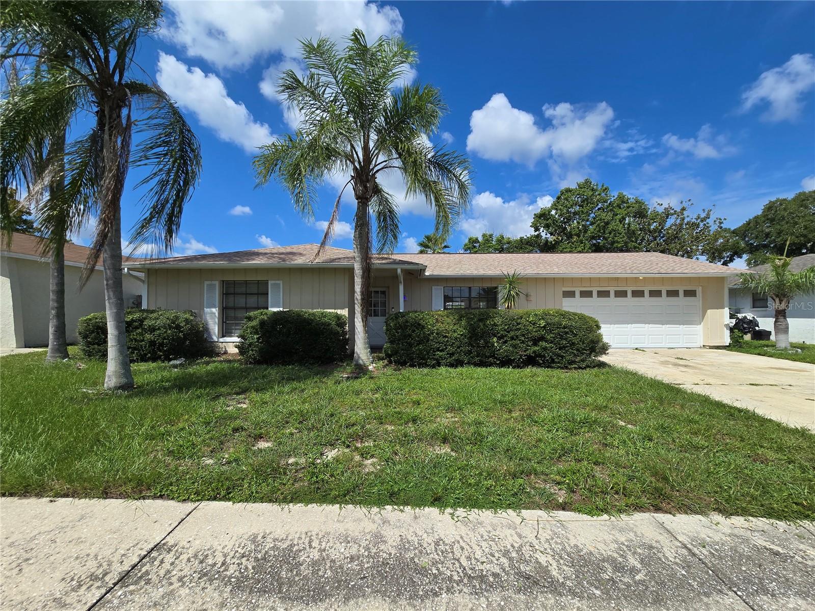 Spacious 2 bedroom, 2 bath, 2 car garage with a beautiful HUGE INGROUND POOL. Fenced yard, nice neighborhood! New flooring throughout and fresh interior paint! Laundry hook-ups located in the 2 car garage. Pool-Care service and yard-care included. New Vinyl fencing will be installed soon. NEW WOOD LOOK CERAMIC TILE FLOORING JUST INSTALLED AND FRESHLY PAINTED INTERIOR. Sorry, NO SMOKING ALLOWED. Grab your agent to book a showing today!