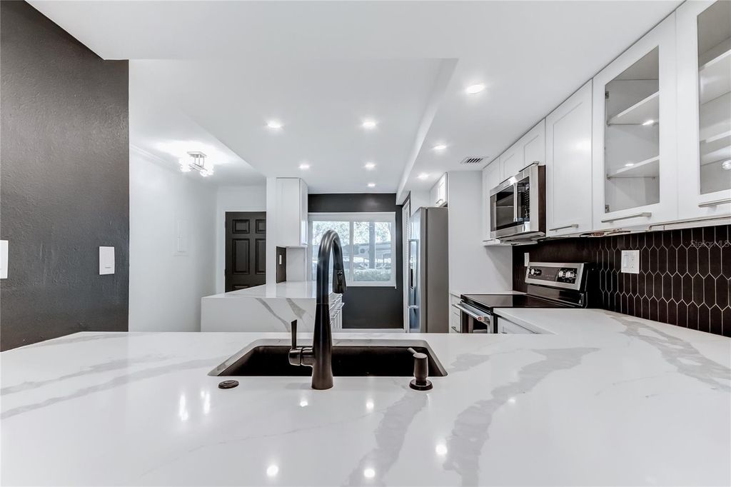 Photo of 650 Island Way #106, Clearwater Beach, FL 33767 (MLS # TB8464298)